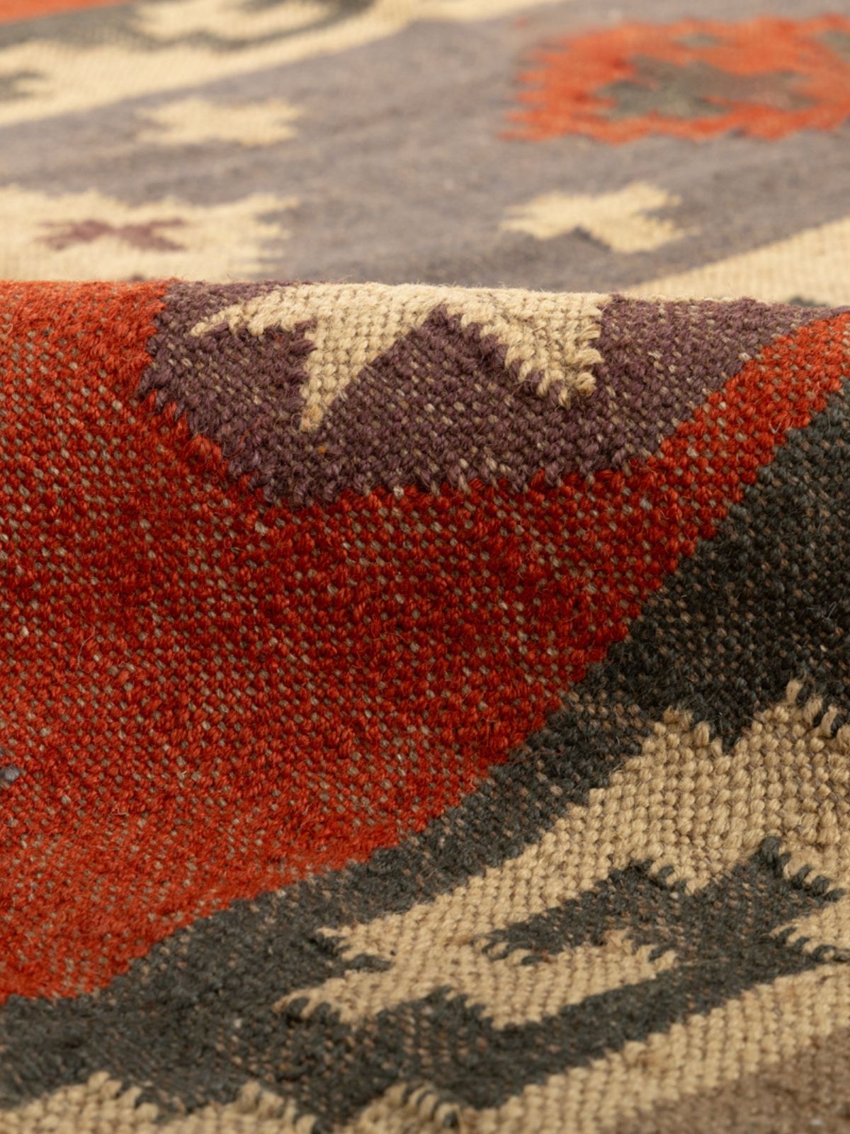 Garnet Glow Kilim Rug detail of the geometric pattern in cotton