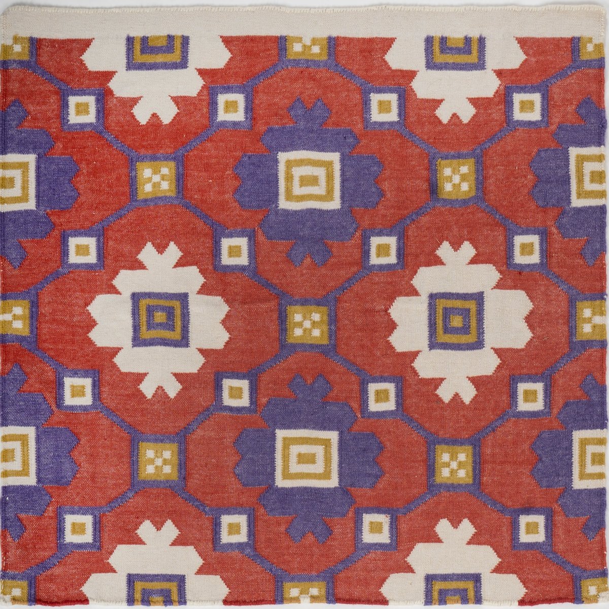 Geometric Anatolian Kilim close-up showing the wool weave and geometric motif