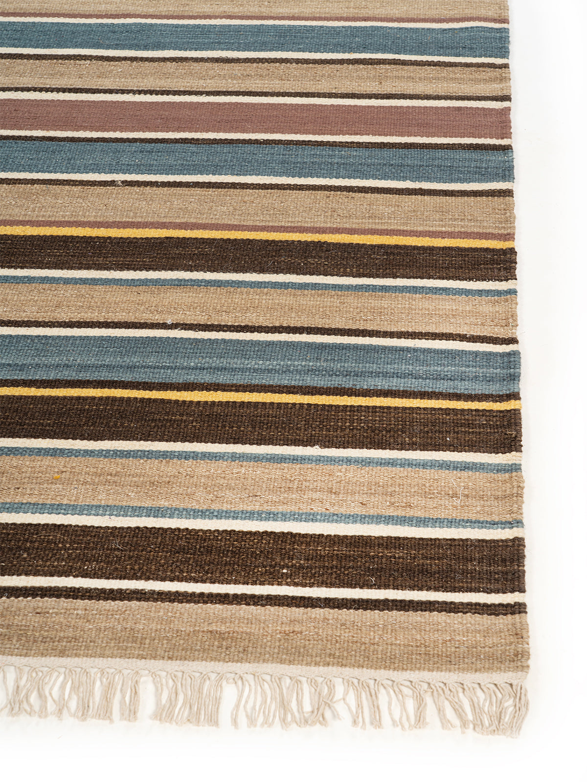Global Stripe Wool Kilim Rug wool rug styled in a living room interior