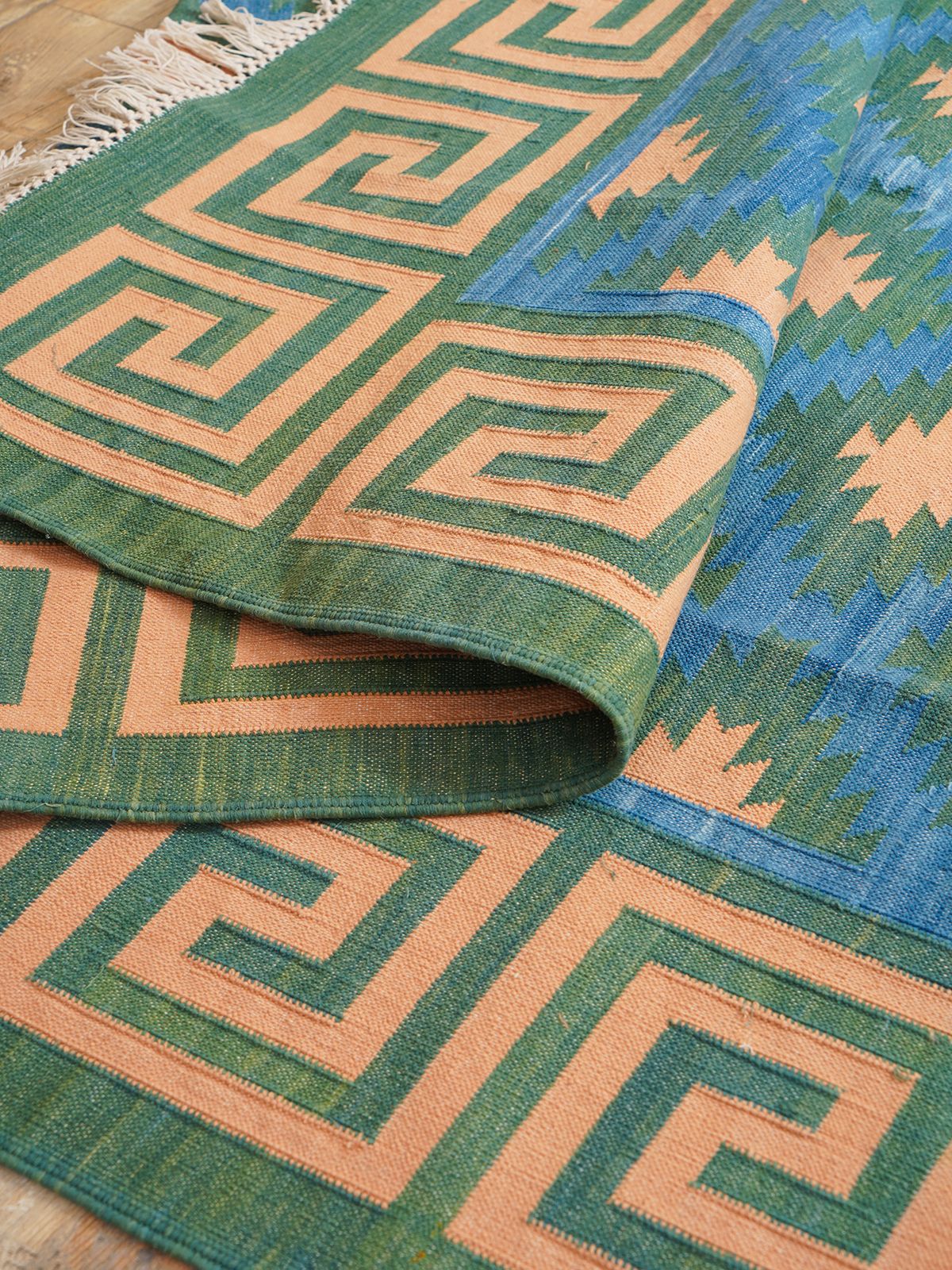 Green hellenic Flatweave rug detail of the striped cotton surface and edge finishing