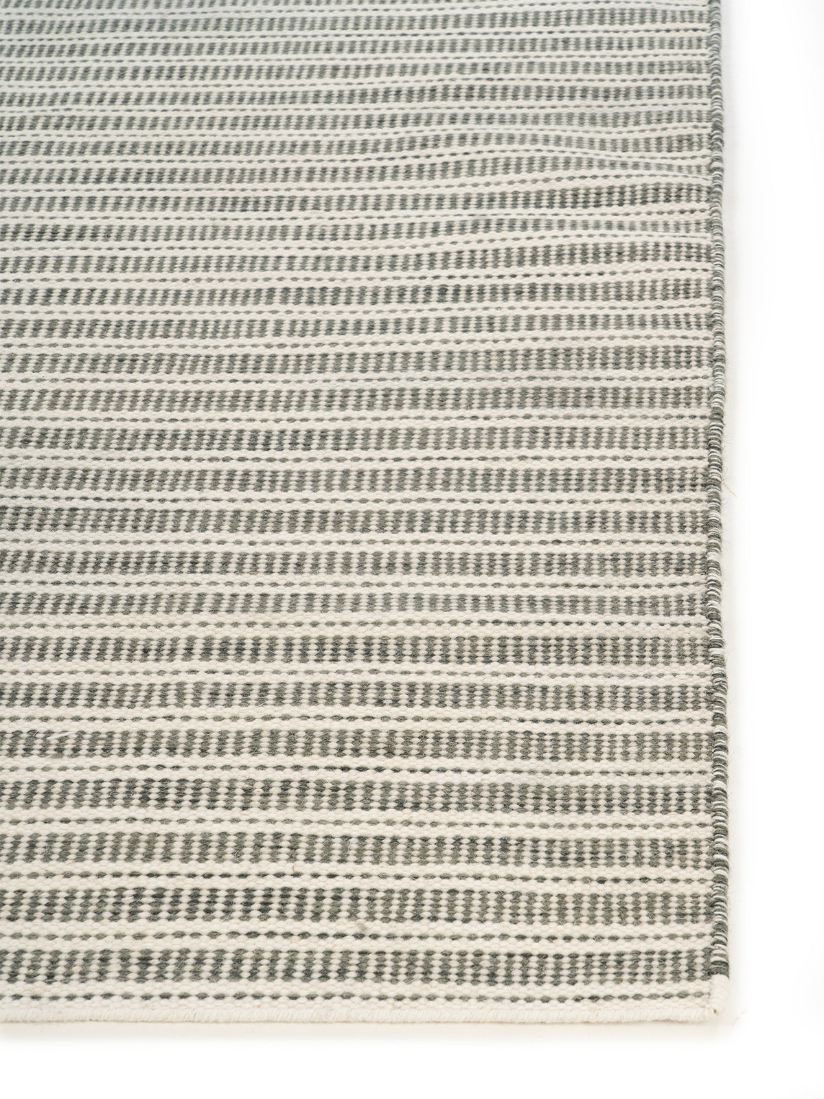 Harrow Handwoven Wool Rug wool rug styled in a living room interior