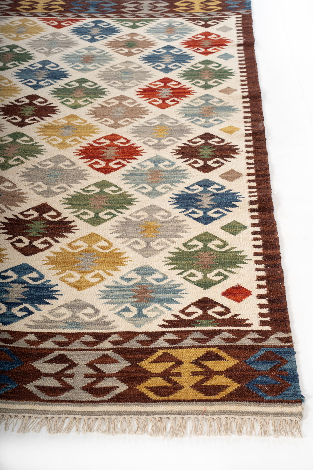 Harvest Mosaic Wool Rug wool rug styled in a living room interior