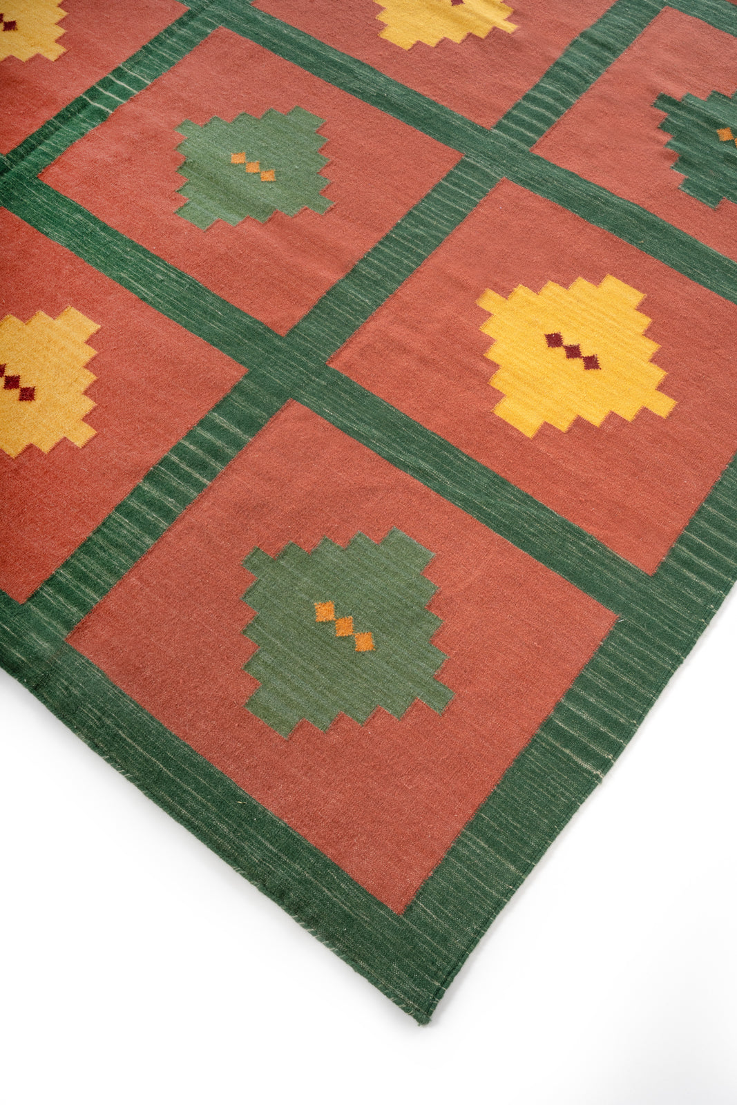 Heritage Mosaic Flatweave Wool Rug wool rug styled in a living room interior