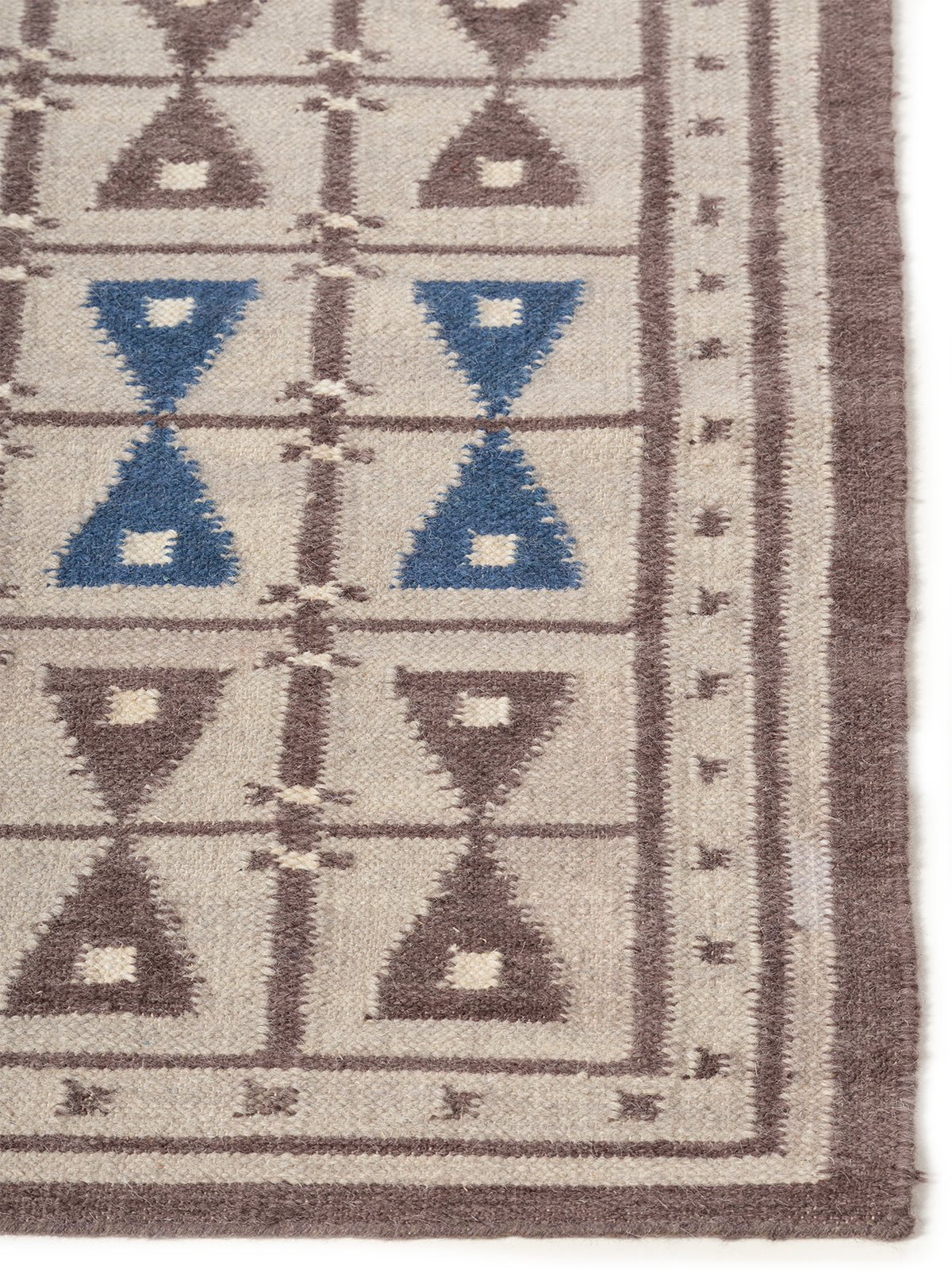 Hourglass Harmony Rug jute rug styled in a living room interior