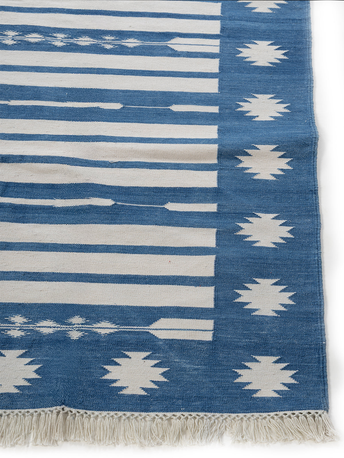 Indigo Horizon cotton rug styled in a living room interior