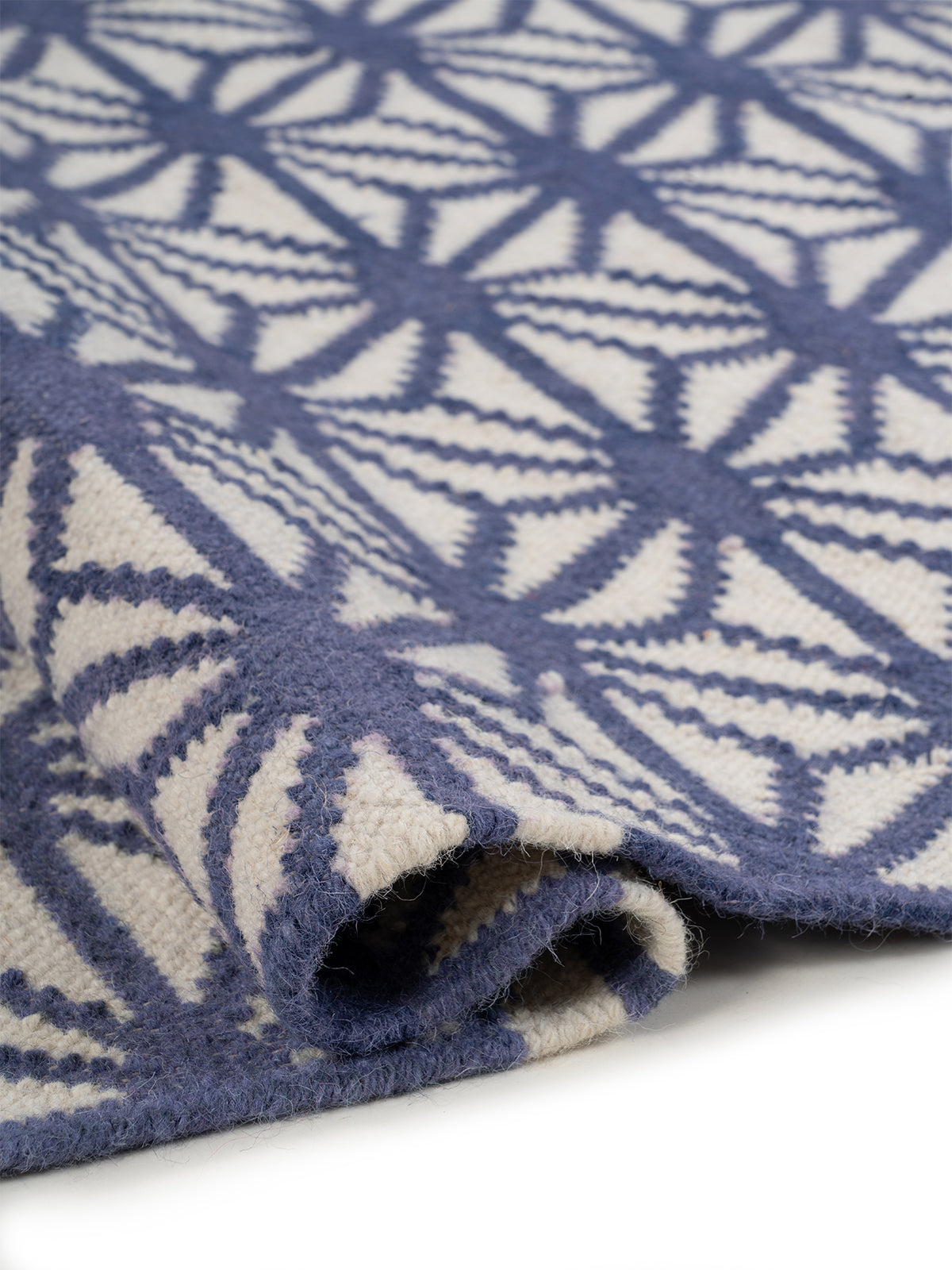 Indigo Starburst Flatweave Rug - texture detail showing wool surface