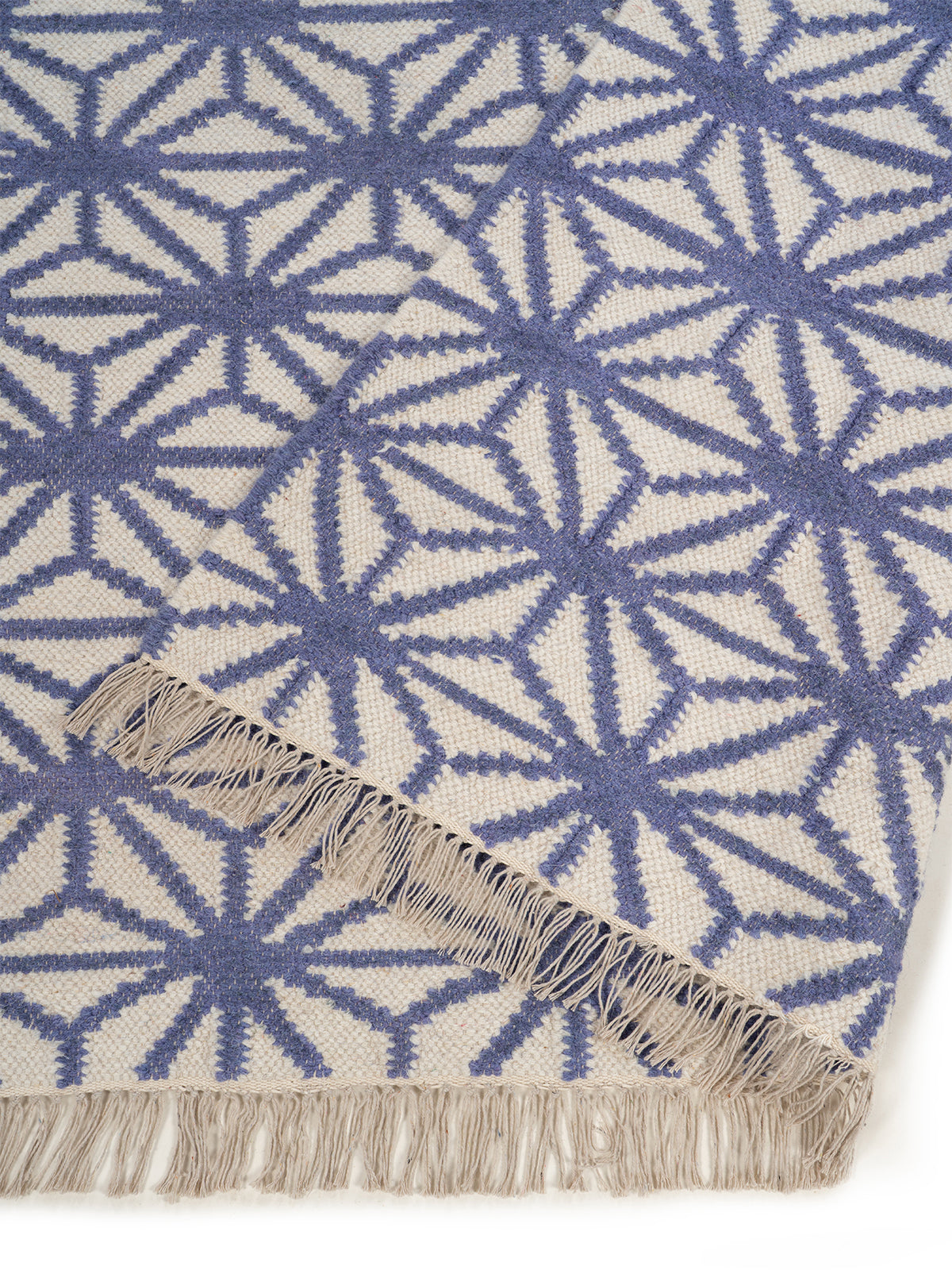 Indigo Starburst Flatweave Rug detail of the geometric pattern in wool