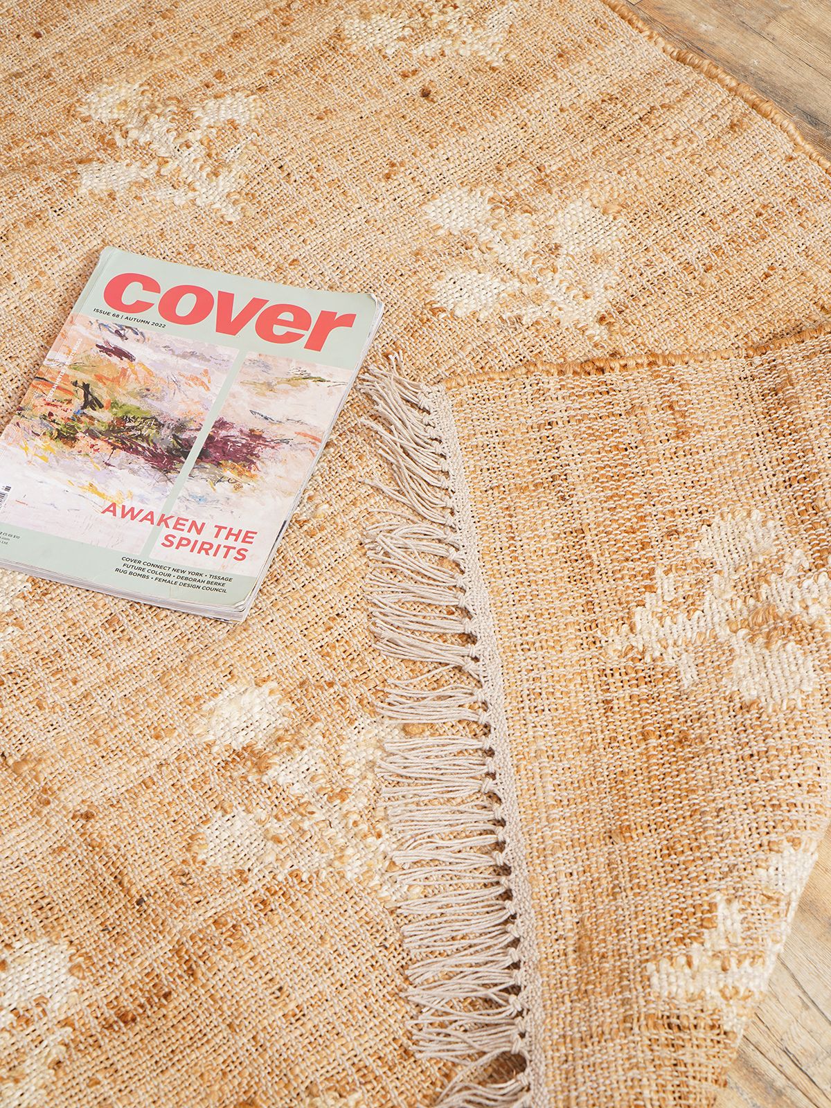 Ivory Blossom Jute Rug detail of the floral motif in jute cut pile