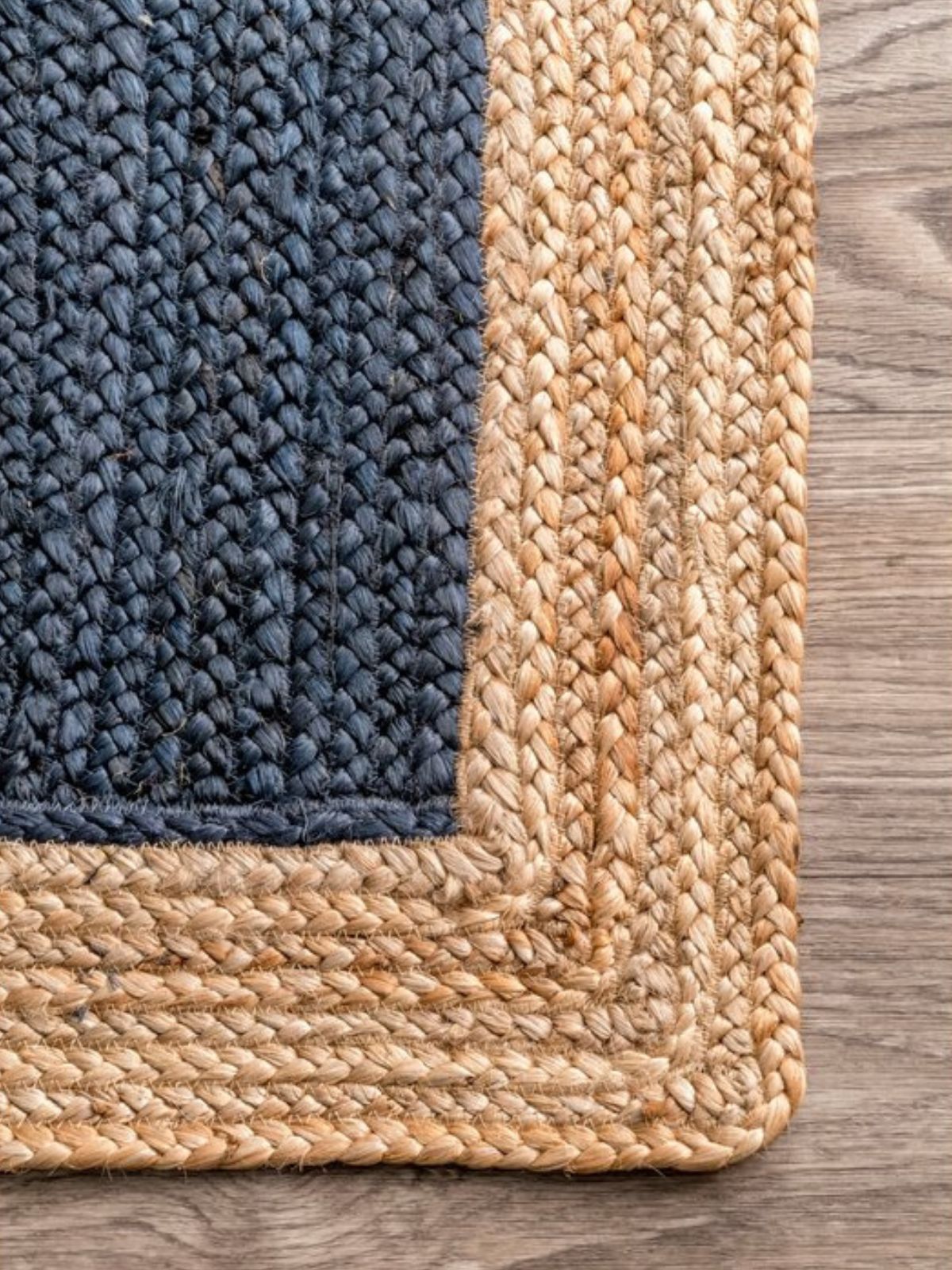 Juba Jute Bordered Runner-Navy jute stair runner styled on a staircase in a designed interior