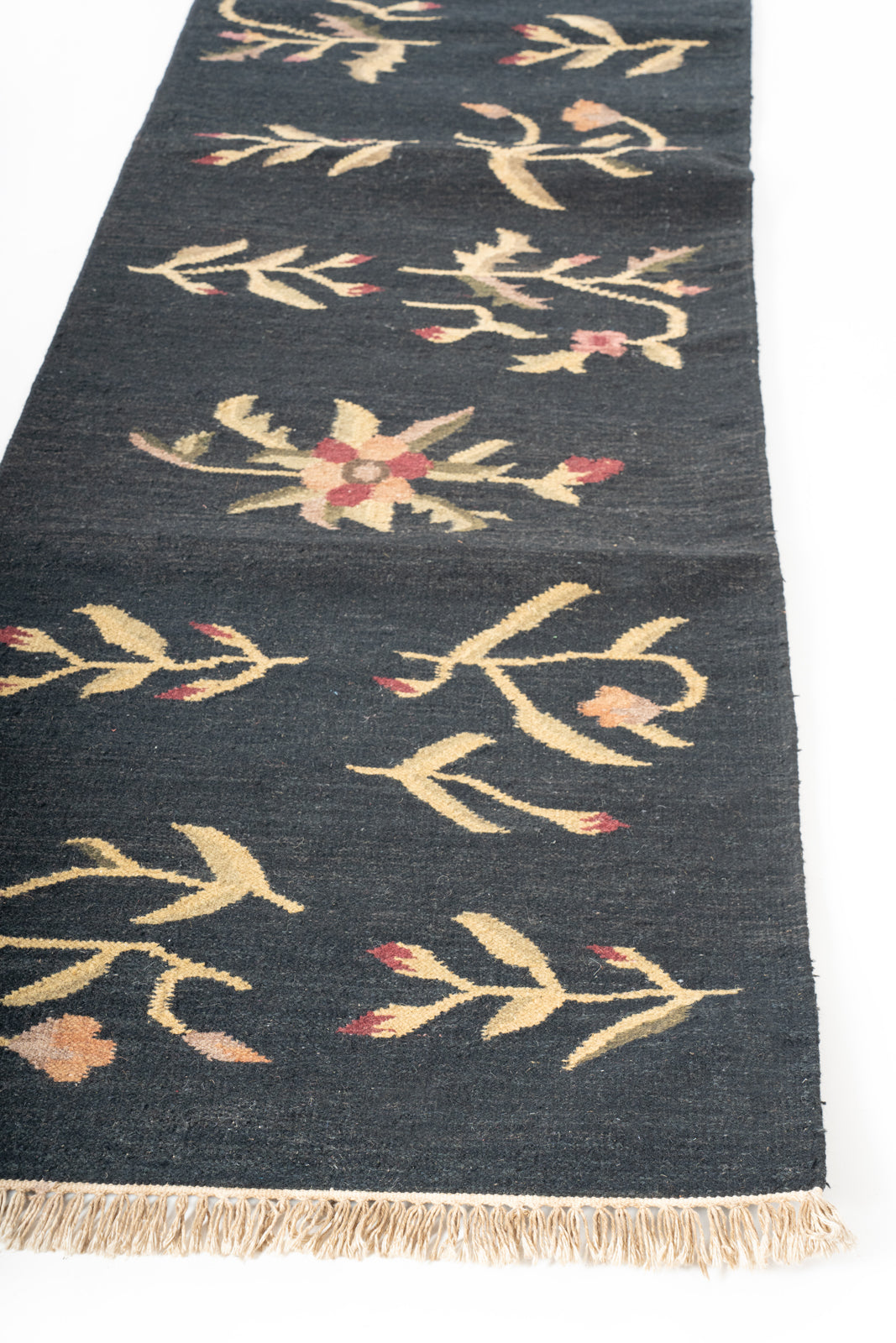 Kashgar Night Wool Runner wool stair runner styled on a staircase in a designed interior