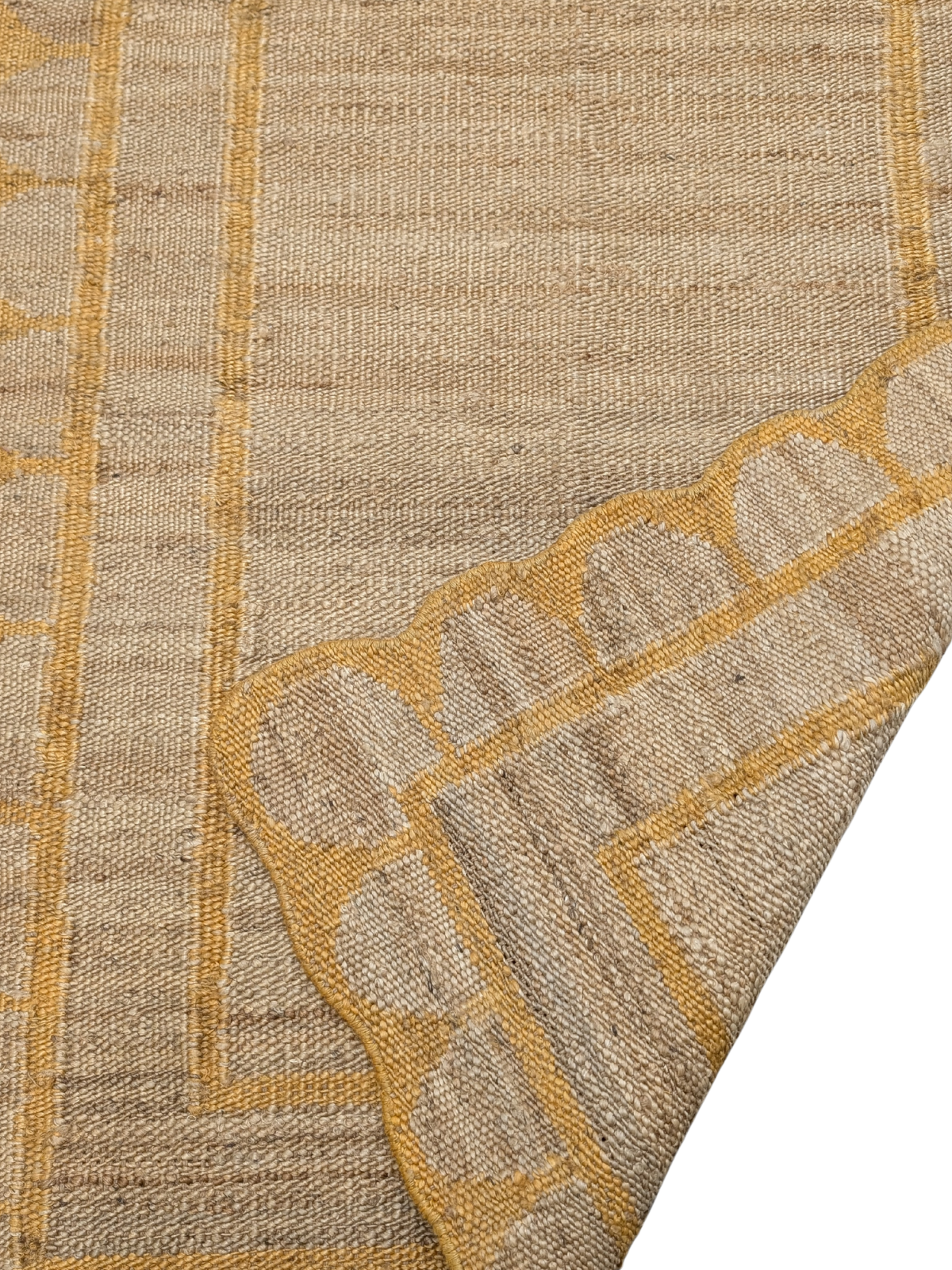 Kigali scalloped hemp rug- Mustard detail showing the textured hemp surface and finishing