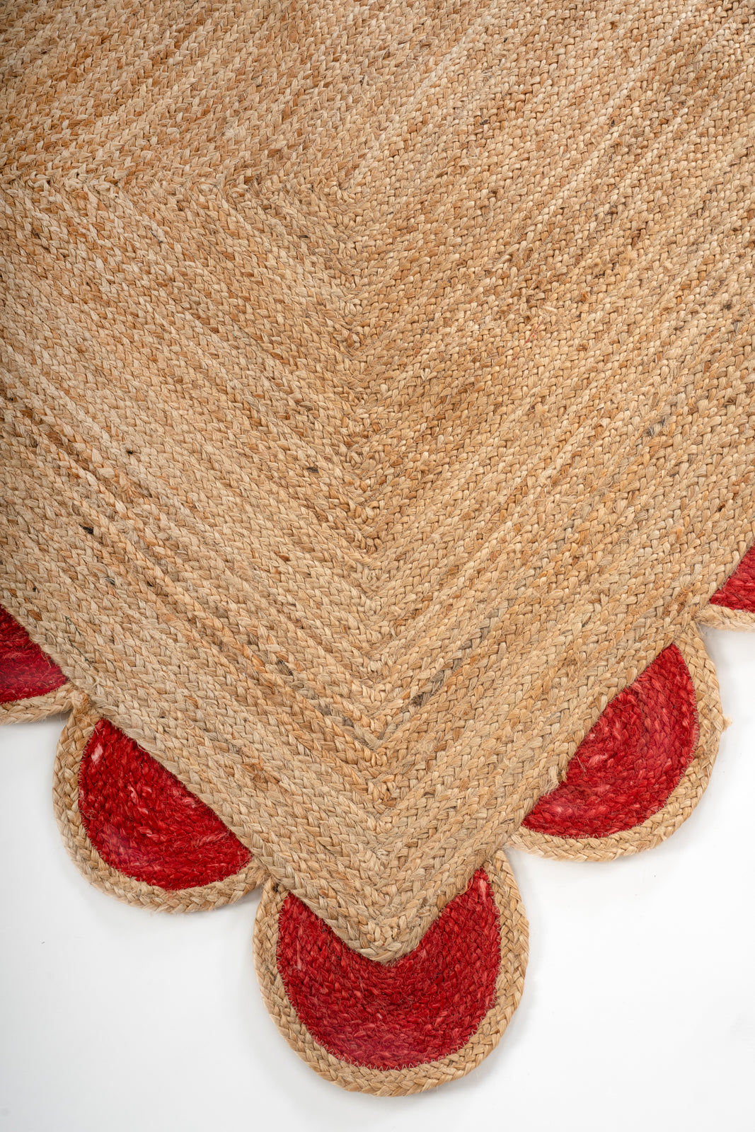 Kribi scalloped jute area rug-Cherry red close-up showing the jute weave and surface texture