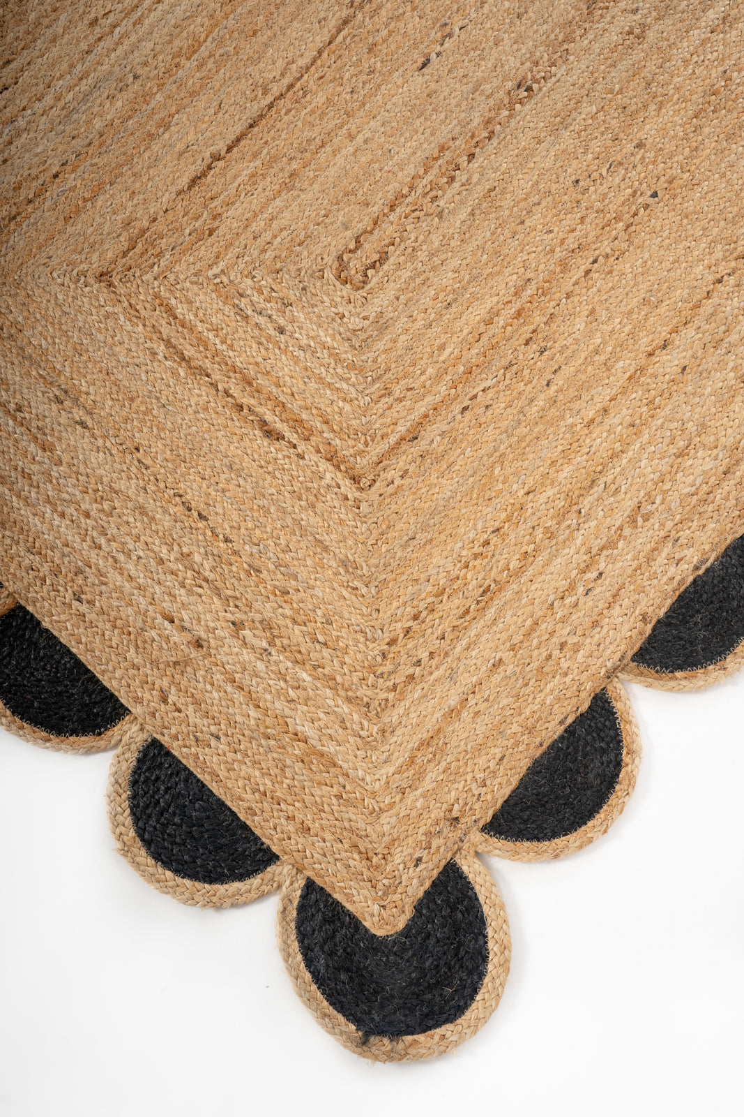 Kribi scalloped jute area rug-Jet Black close-up showing the jute weave and surface texture