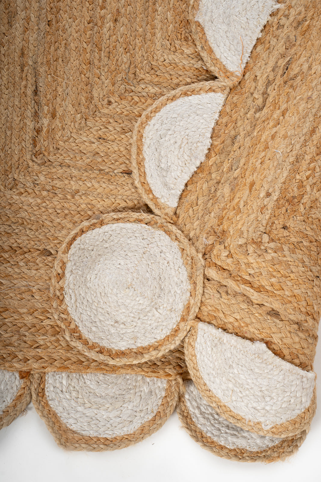 Kribi scalloped jute area rug-White detail showing the textured jute surface and finishing