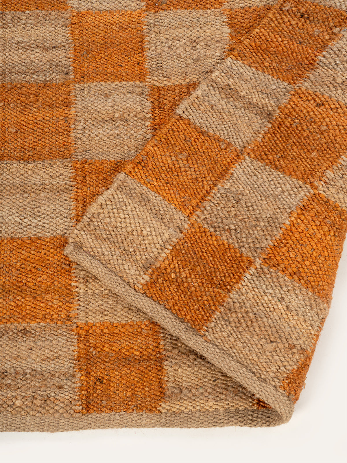 Lincoln checkered jute rug-Orange detail of the geometric pattern in jute