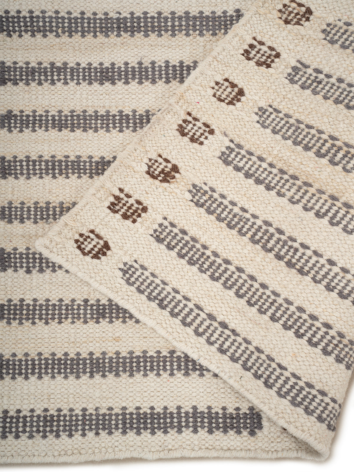Linear Rhythm Handwoven Wool Rug detail of the striped wool surface and edge finishing