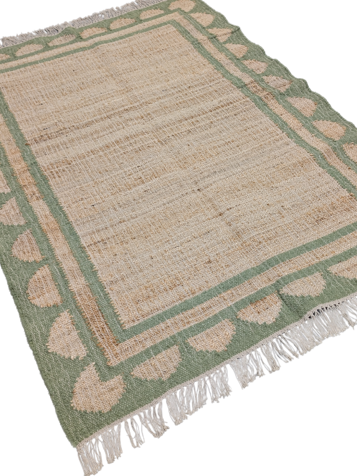 Lira scalloped Jute Rug-Green jute rug styled in a living room interior