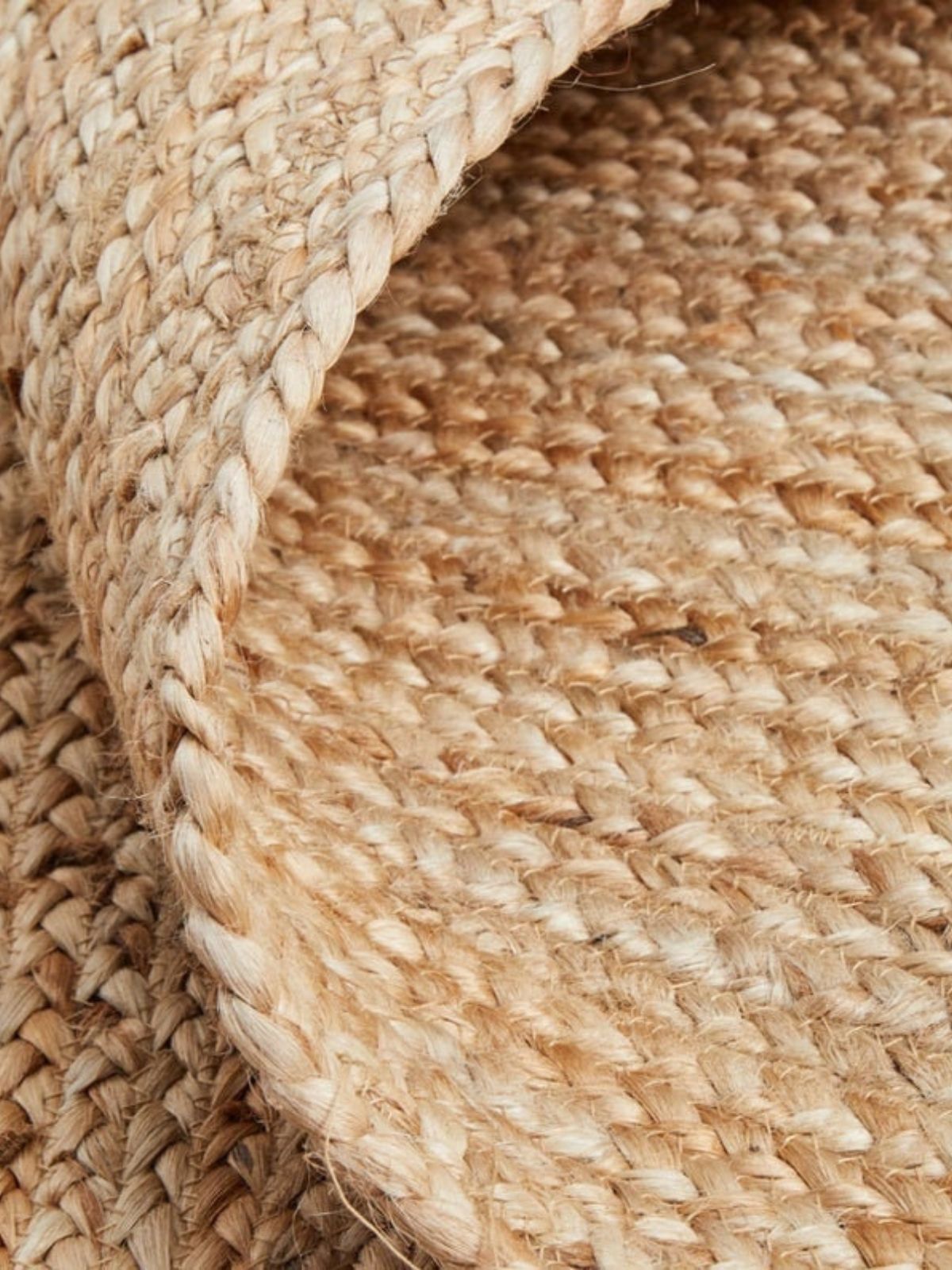 Lusaka natural jute braided area rug close-up showing the jute weave and surface texture