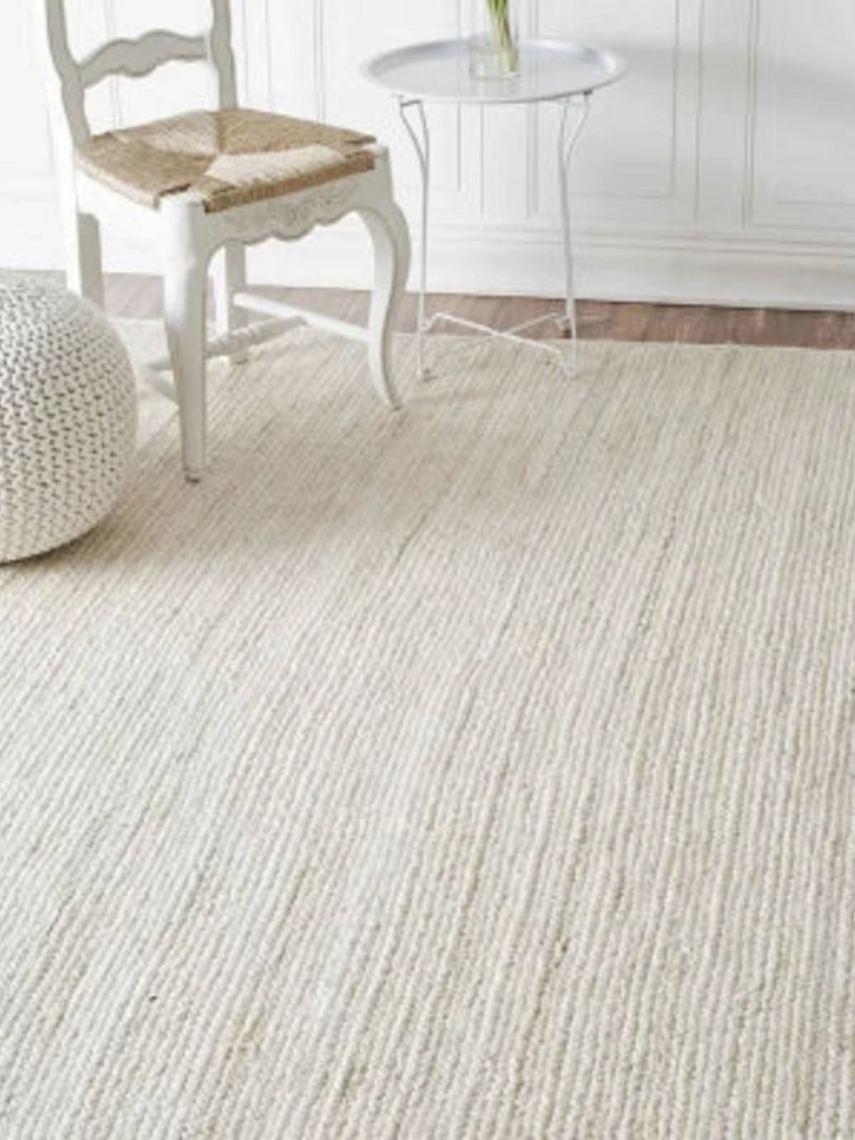 Lusaka natural jute braided area rug-Ivory jute rug styled in a living room interior