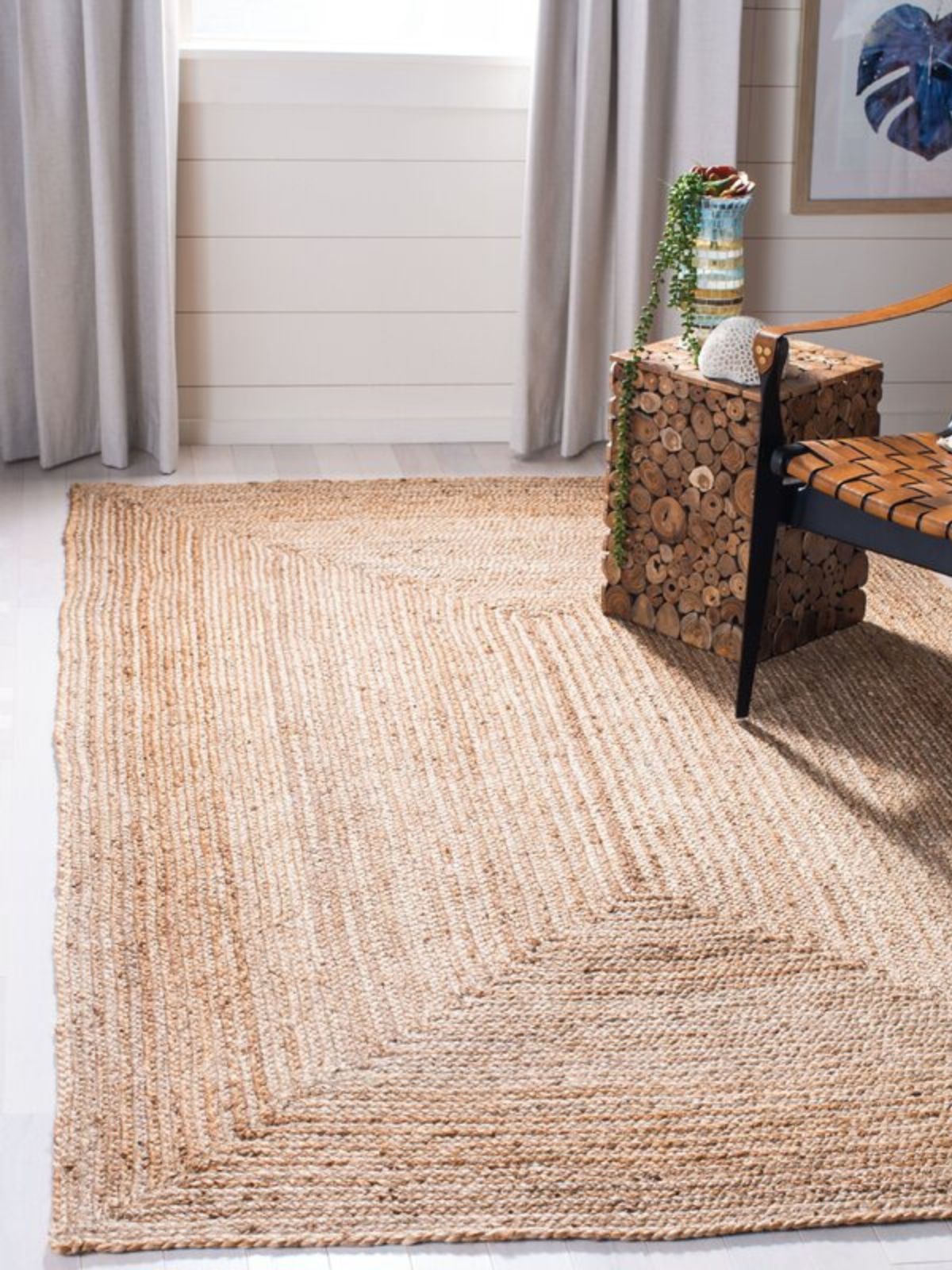 Lusaka natural jute braided area rug-Natural jute rug styled in a living room interior