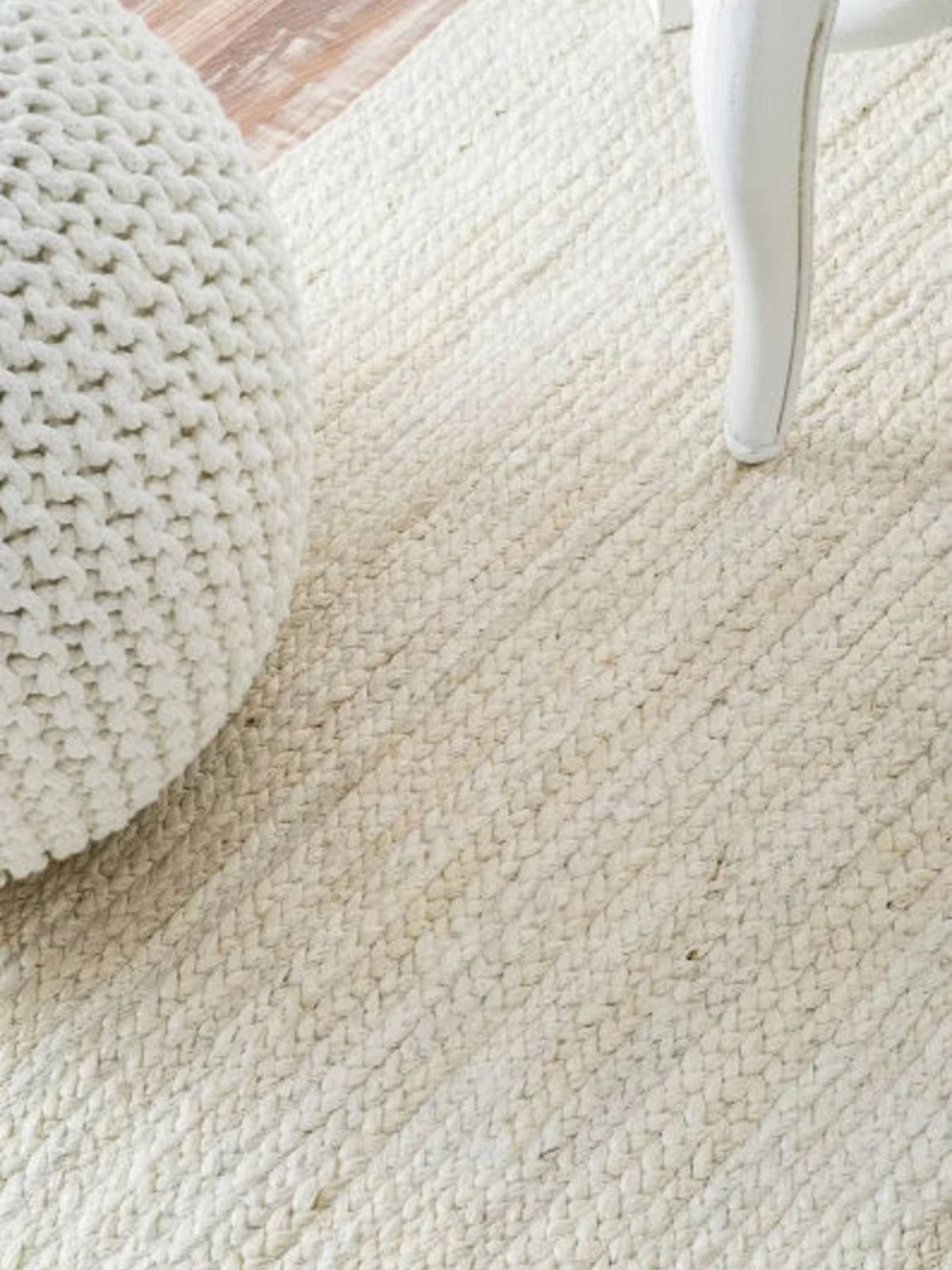 Lusaka Natural Jute Braided Runner-Ivory jute stair runner styled on a staircase in a designed interior