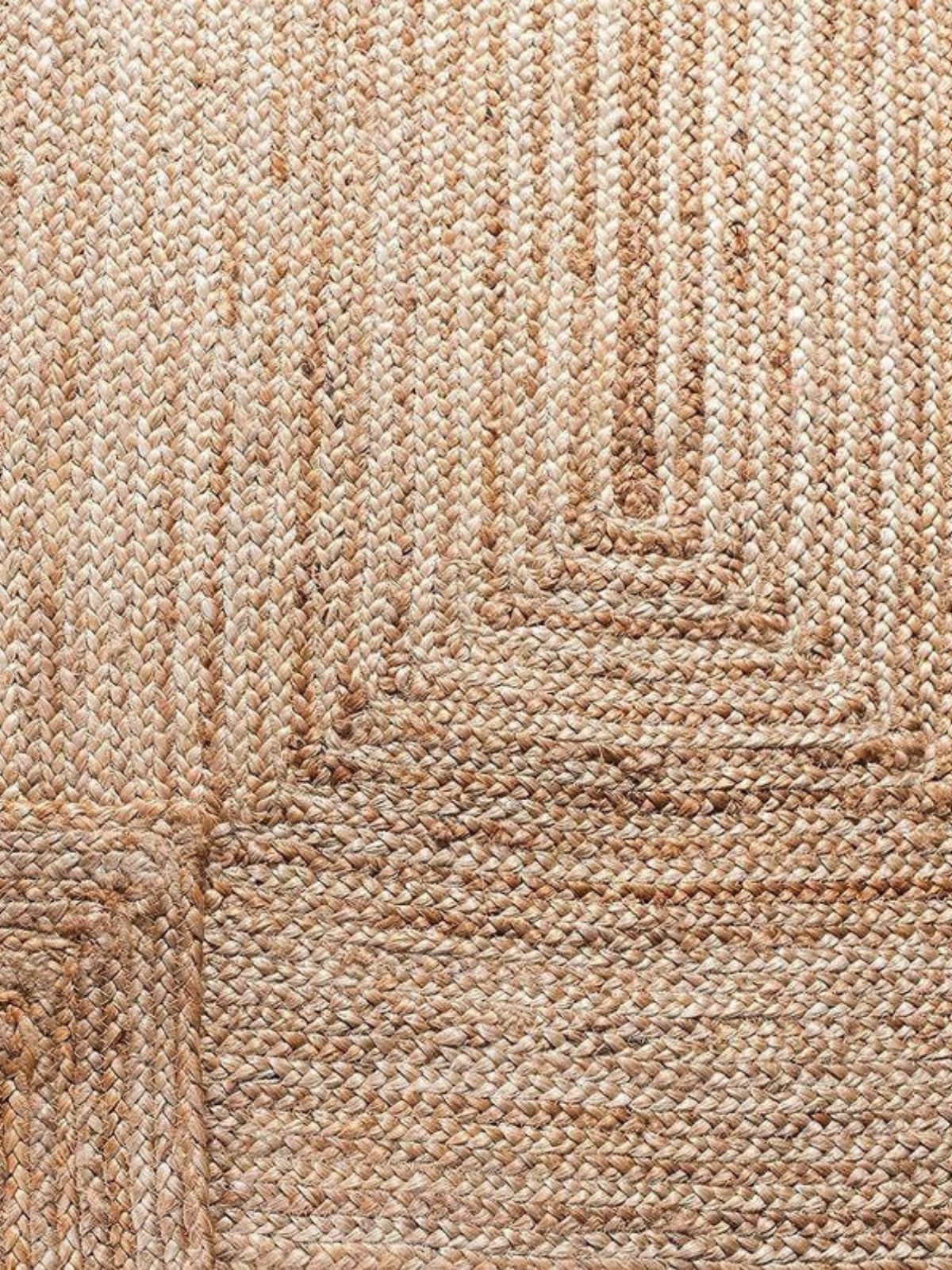 Lusaka Natural Jute Braided Runner jute stair runner styled on a staircase in a designed interior