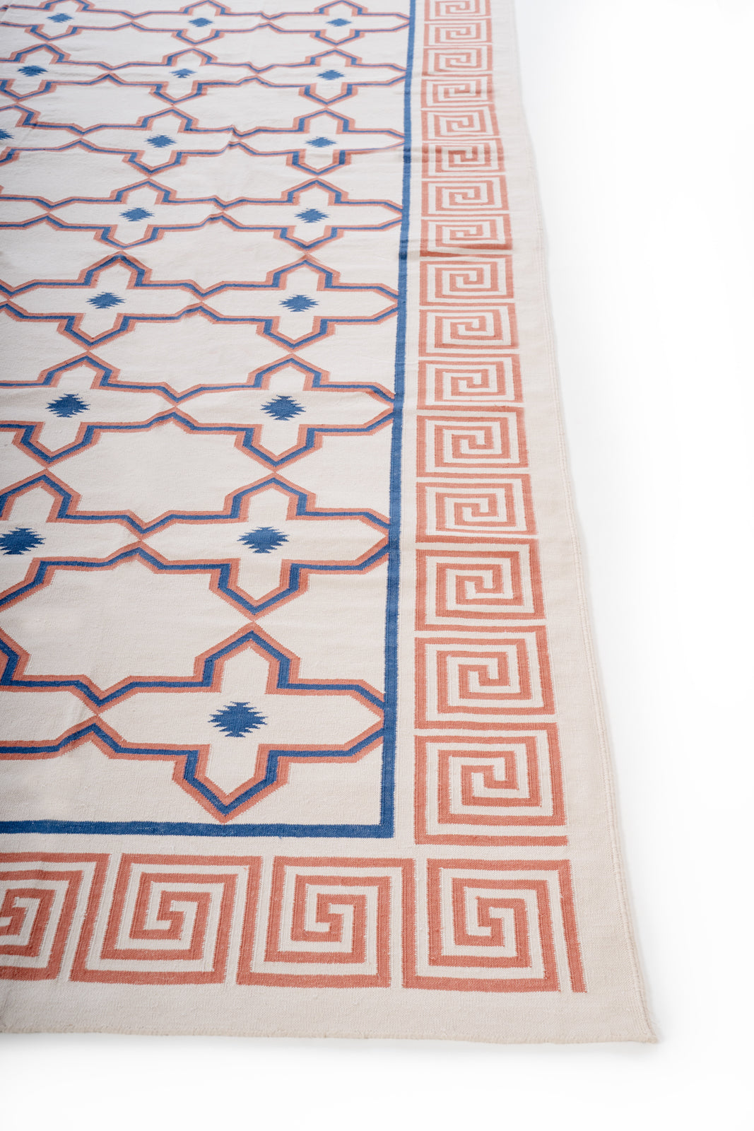 Mandvi Lattice Flatweave Rug cotton rug styled in a living room interior