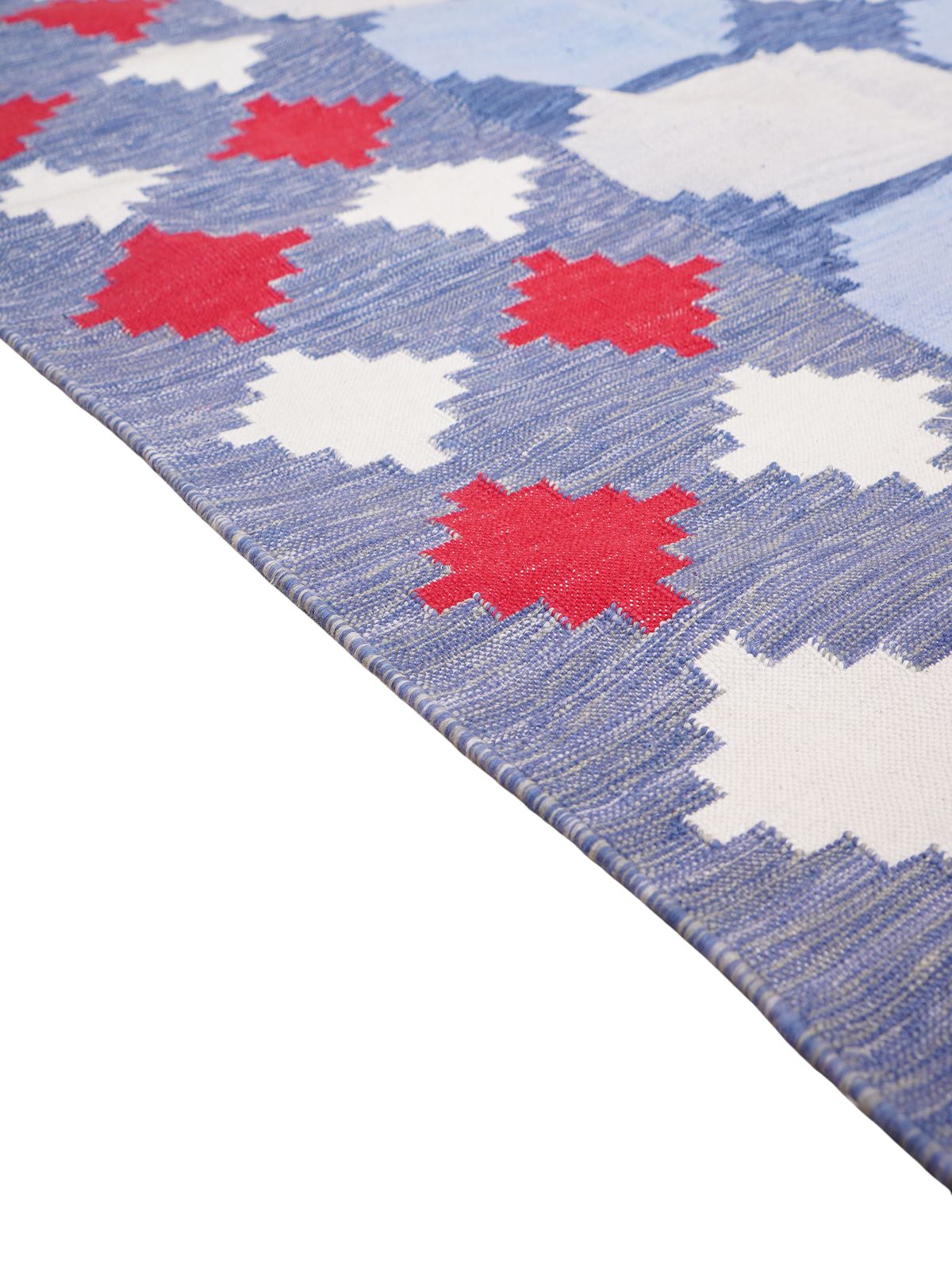 Maritime Melody Flatweave Rug cotton rug styled in a living room interior