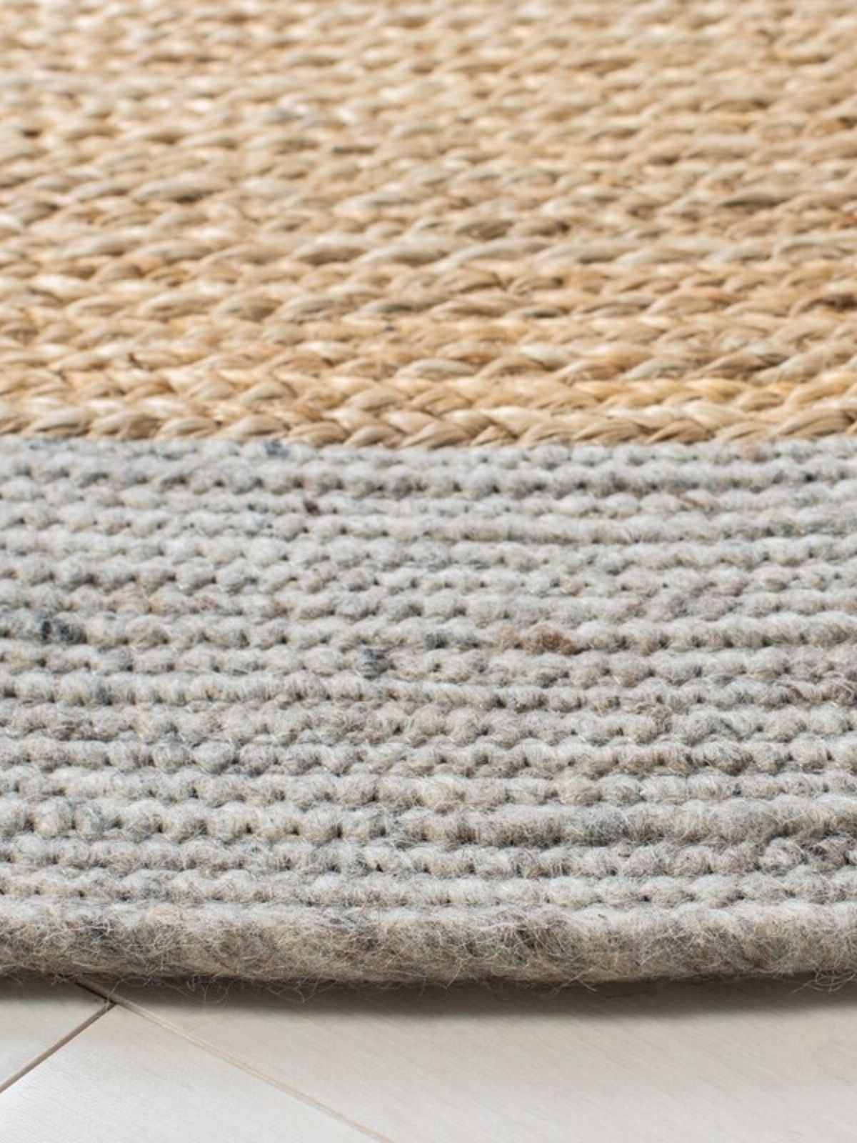 Maseru jute bordered oval area rug detail of the striped jute surface and edge finishing