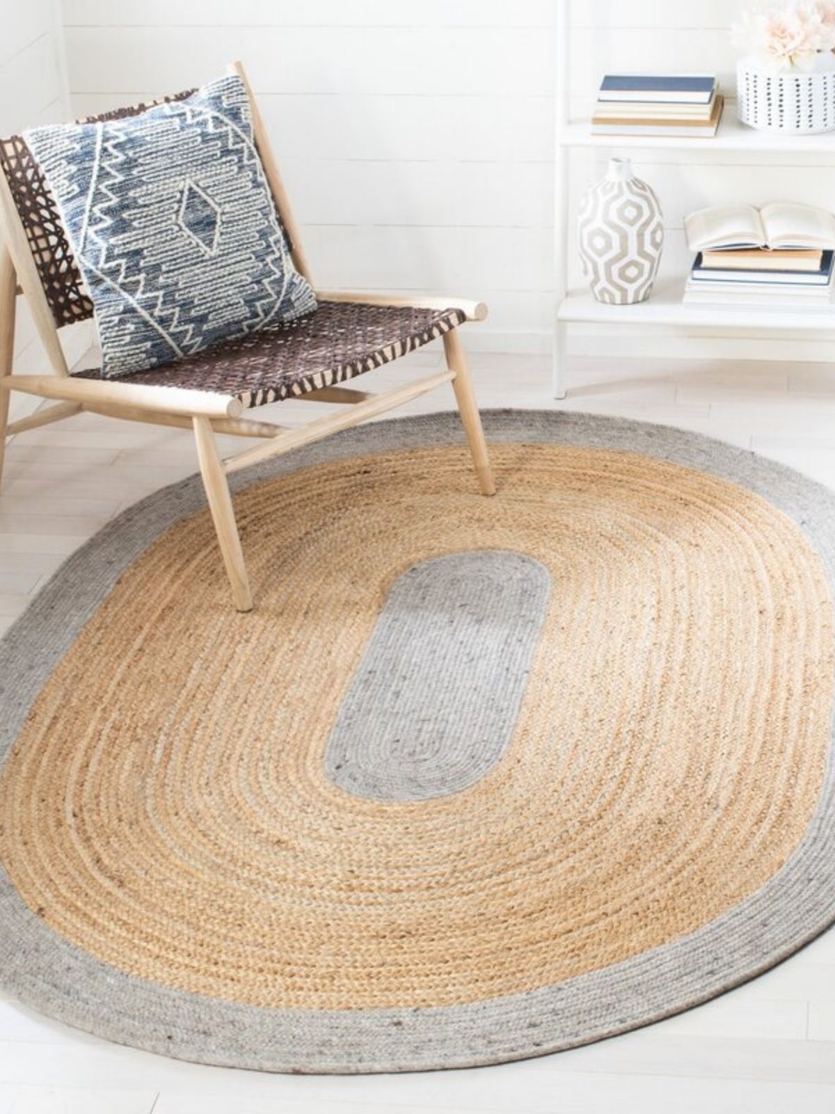 Maseru jute bordered oval area rug jute rug styled in a living room interior