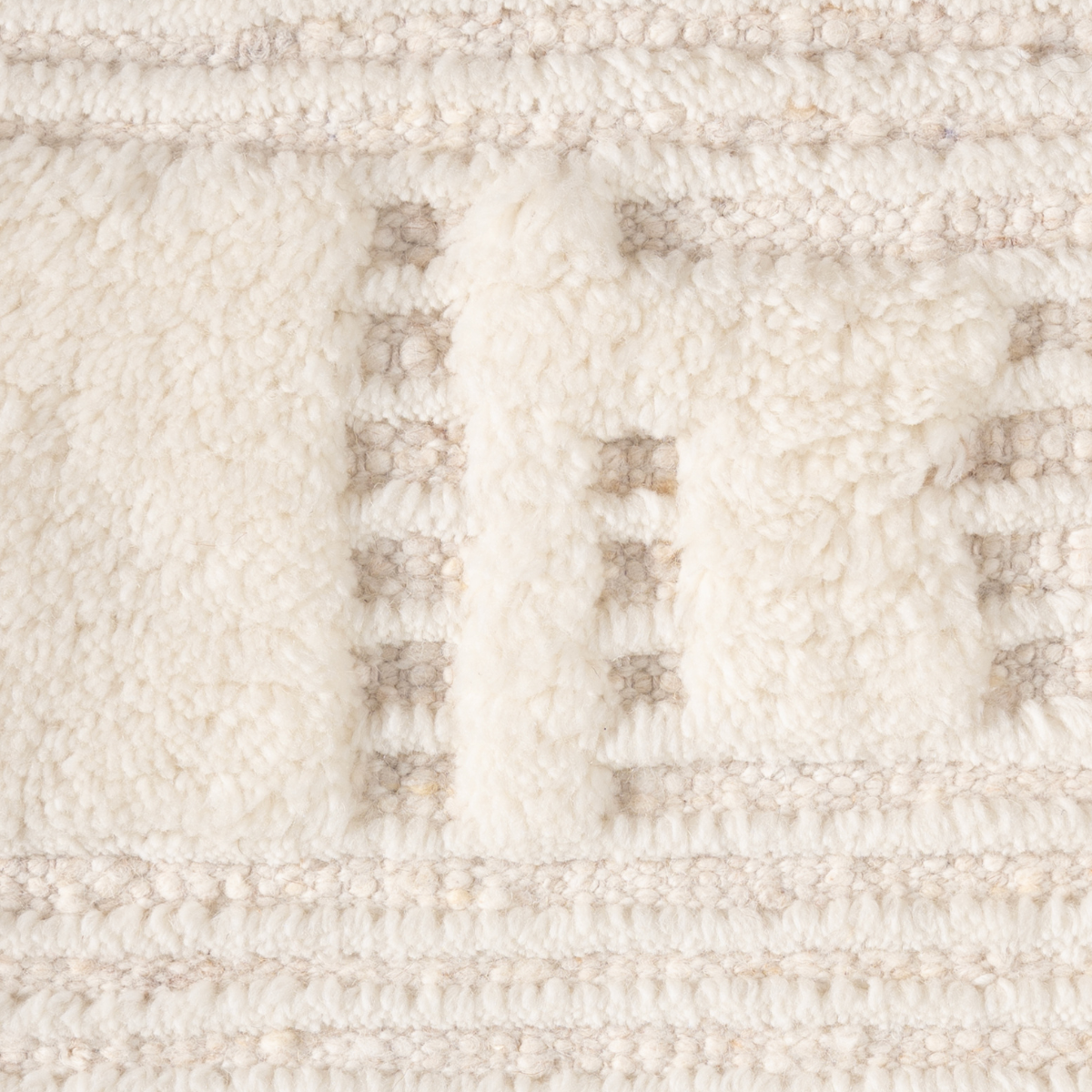 Mehran : Fossil Trace close-up showing the wool weave and geometric motif