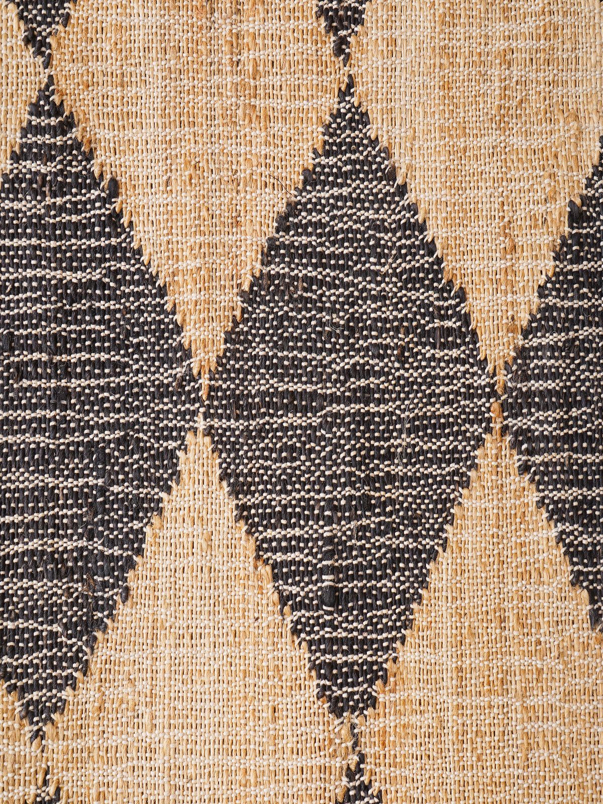 Midnight Mirage Jute Rug jute rug styled in a living room interior
