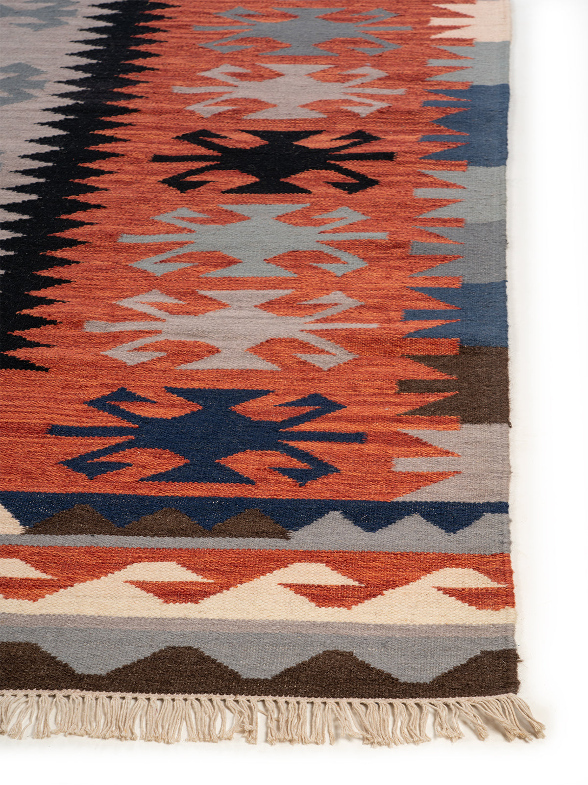 Monochrome Folk Motif Wool Rug wool rug styled in a living room interior