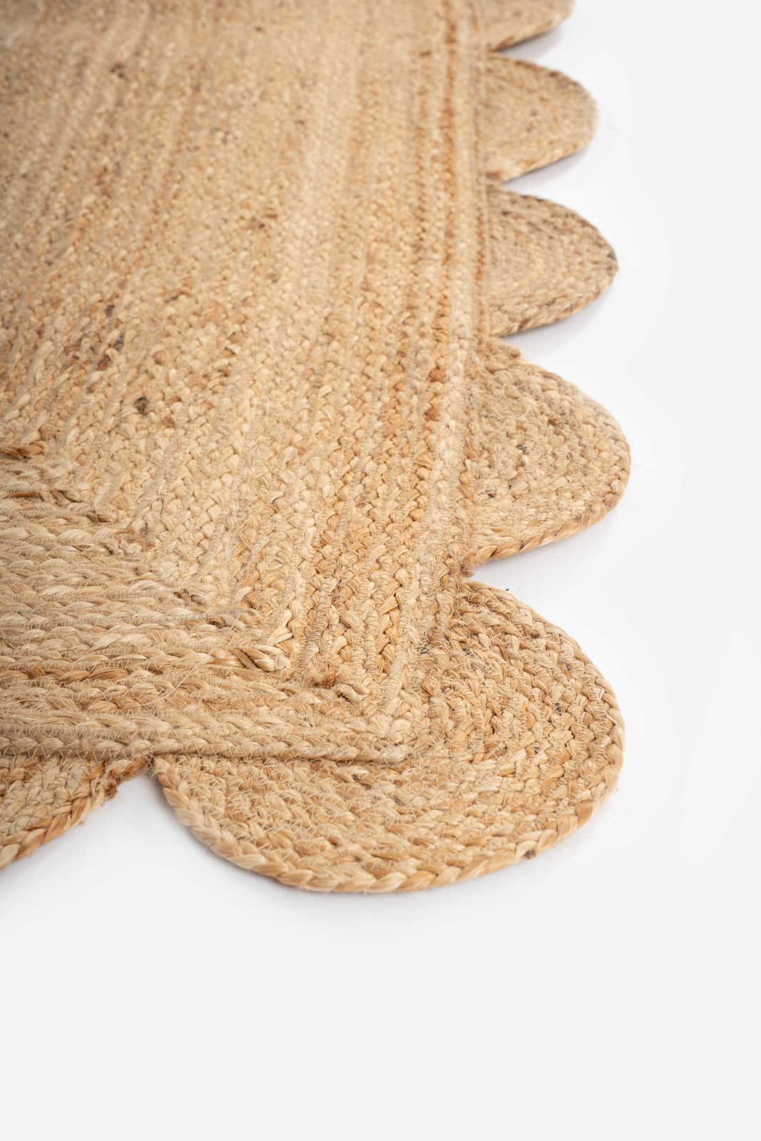 Mwanza scalloped jute rug- natural - jute runner laid in a hallway view