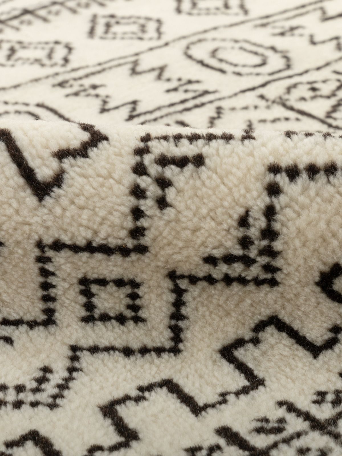 Nomad Noir Hand-Knotted Tribal Rug detail of the traditional motif in wool