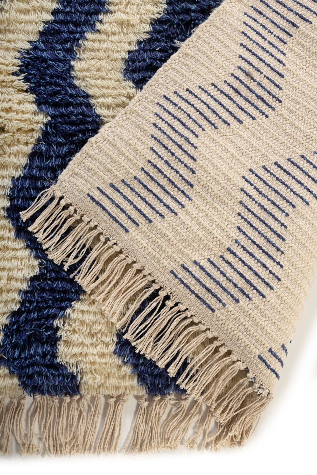 Ocean Drift Wool Rug detail of the striped wool surface and edge finishing