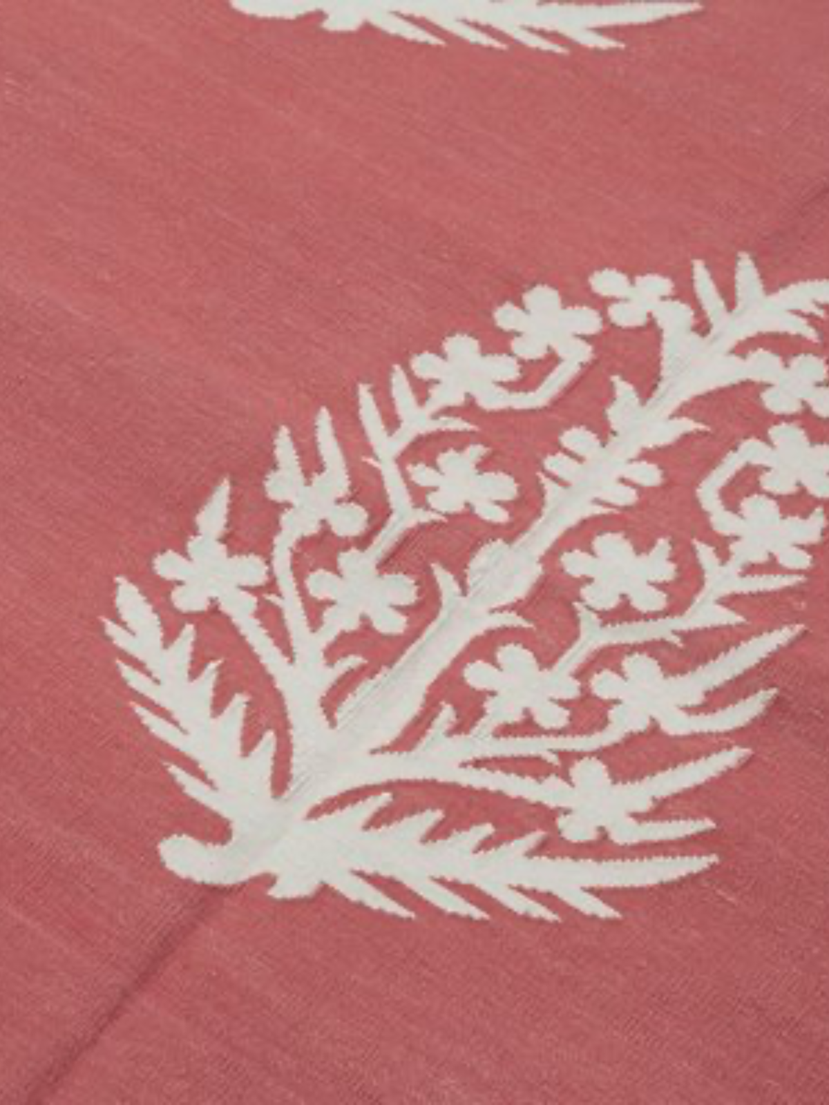 Orchid Elegance Wool Flatweave Rug-Red detail of the floral motif in wool cut pile