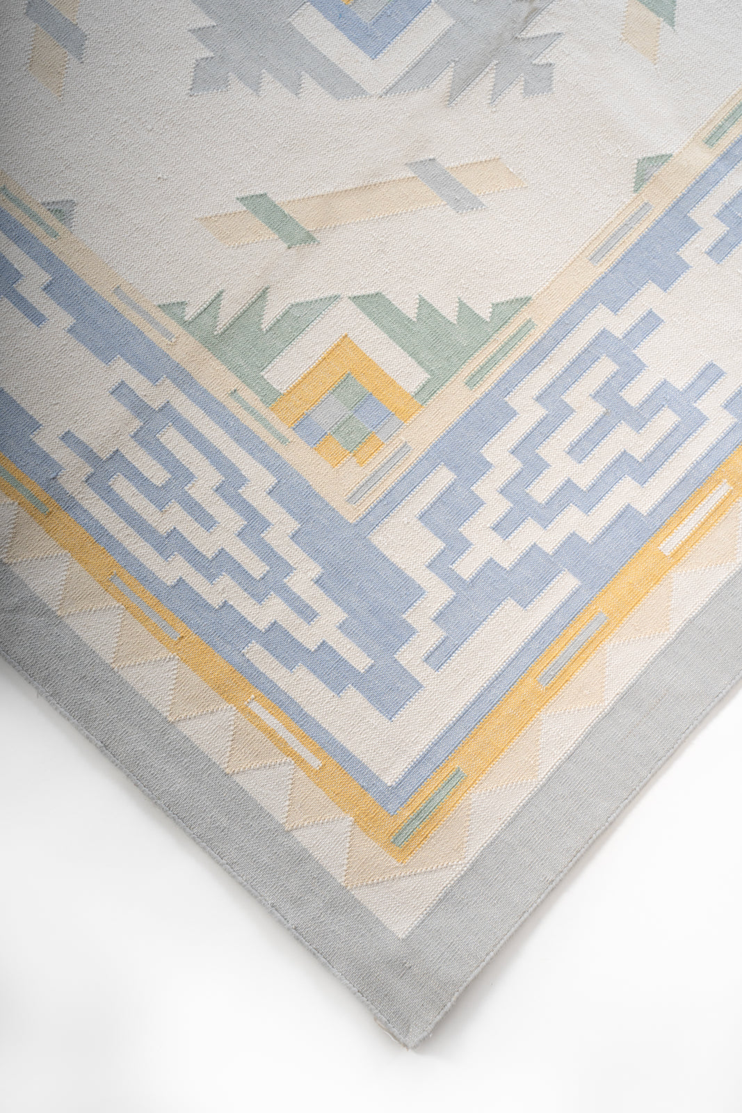 Pondicherry Tranquil Flatweave Rug close-up showing the cotton weave and striped pattern