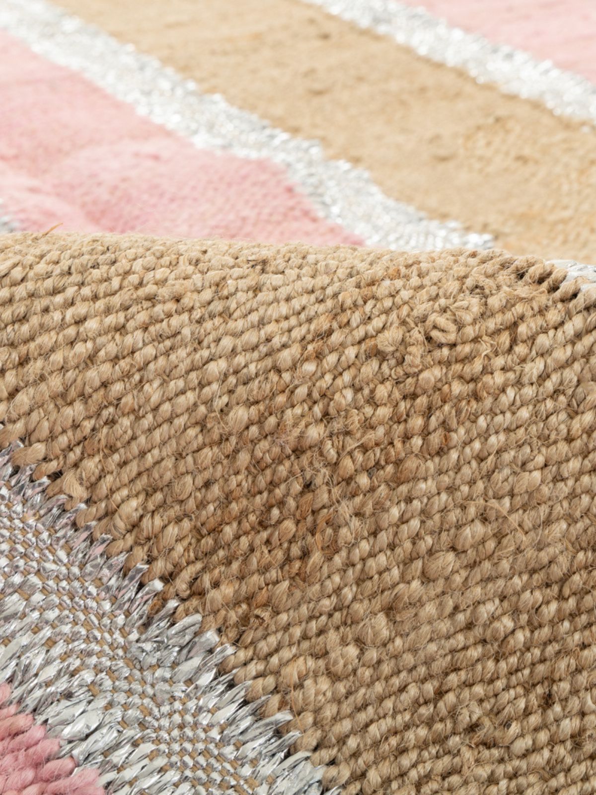 Rosewood Striped Jute Rug detail of the striped jute surface and edge finishing