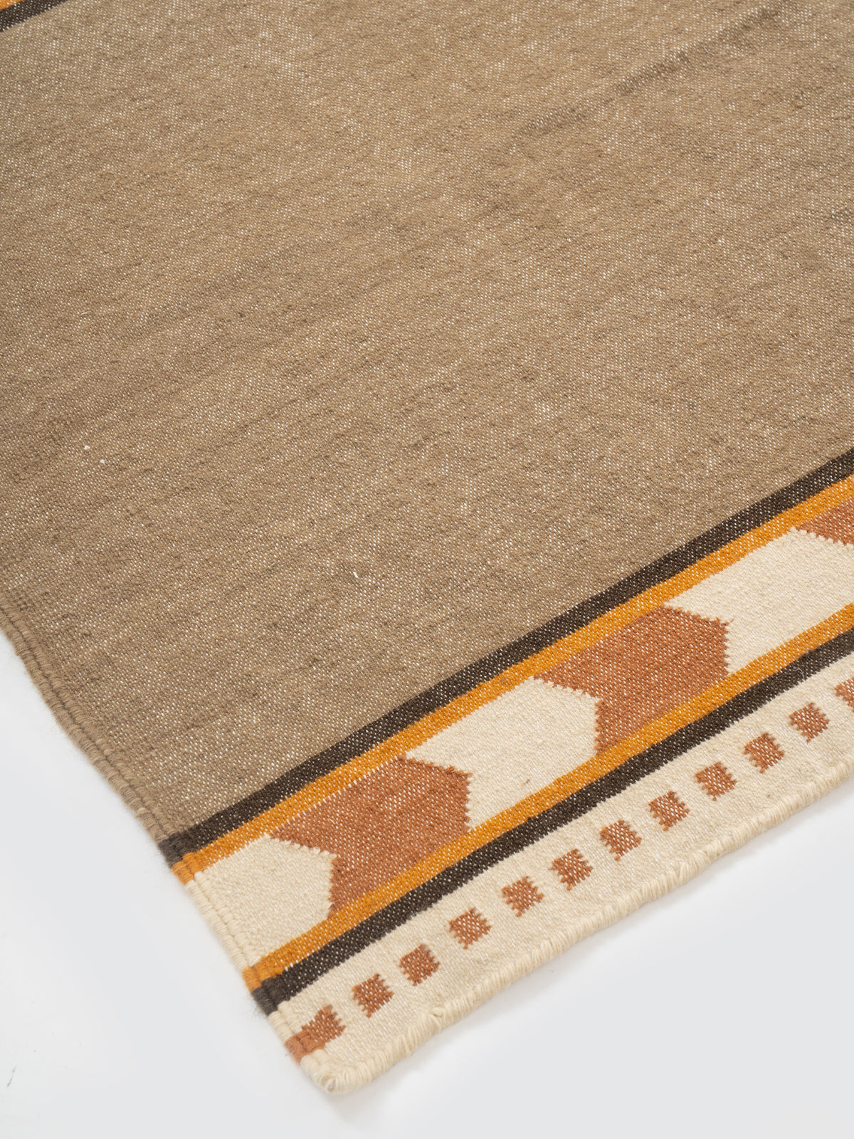 Rust Moor Runner close-up showing the cotton weave and stripes surface
