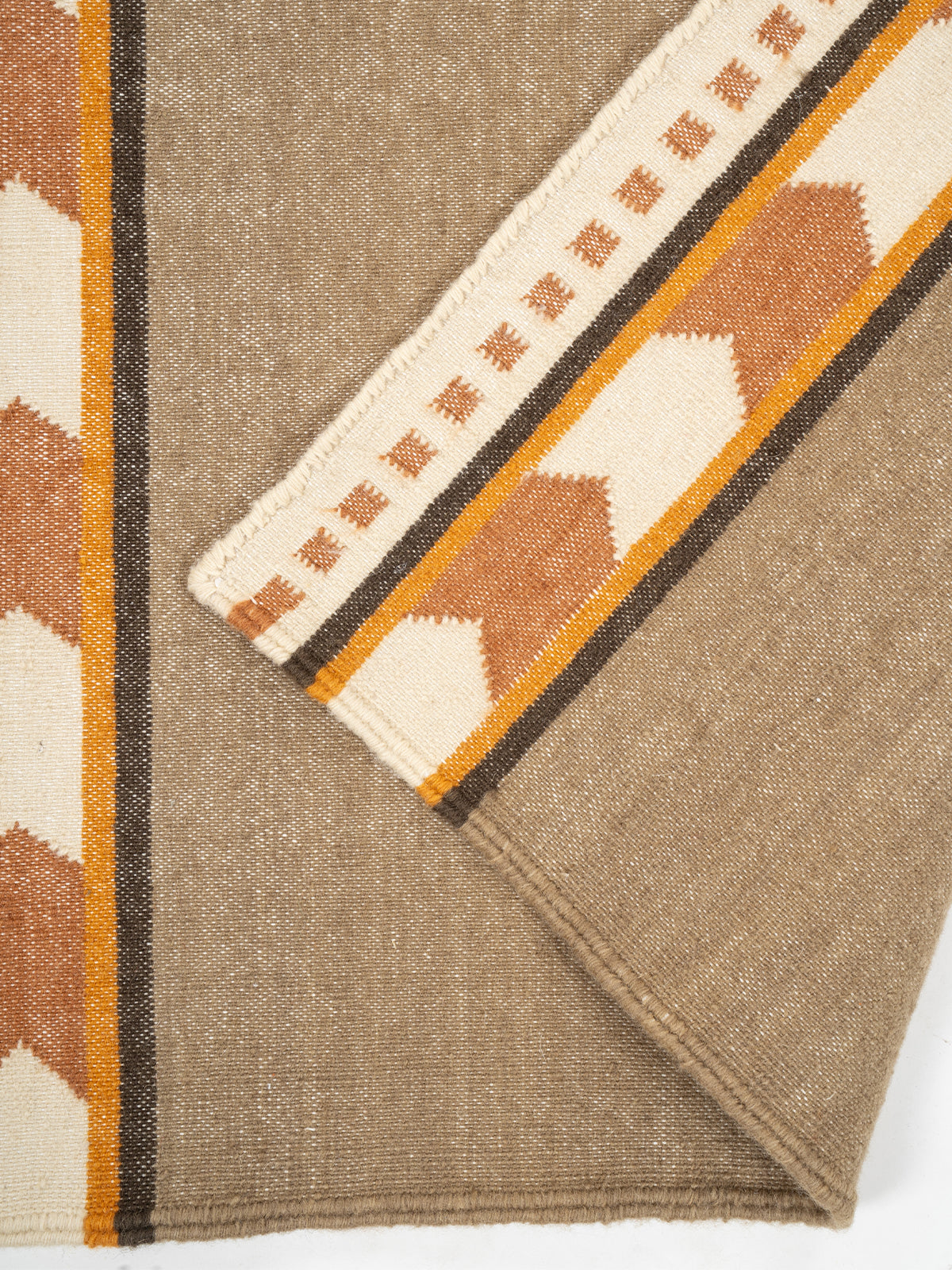 Rust Moor Runner detail showing edge binding and cotton finishing of the runner