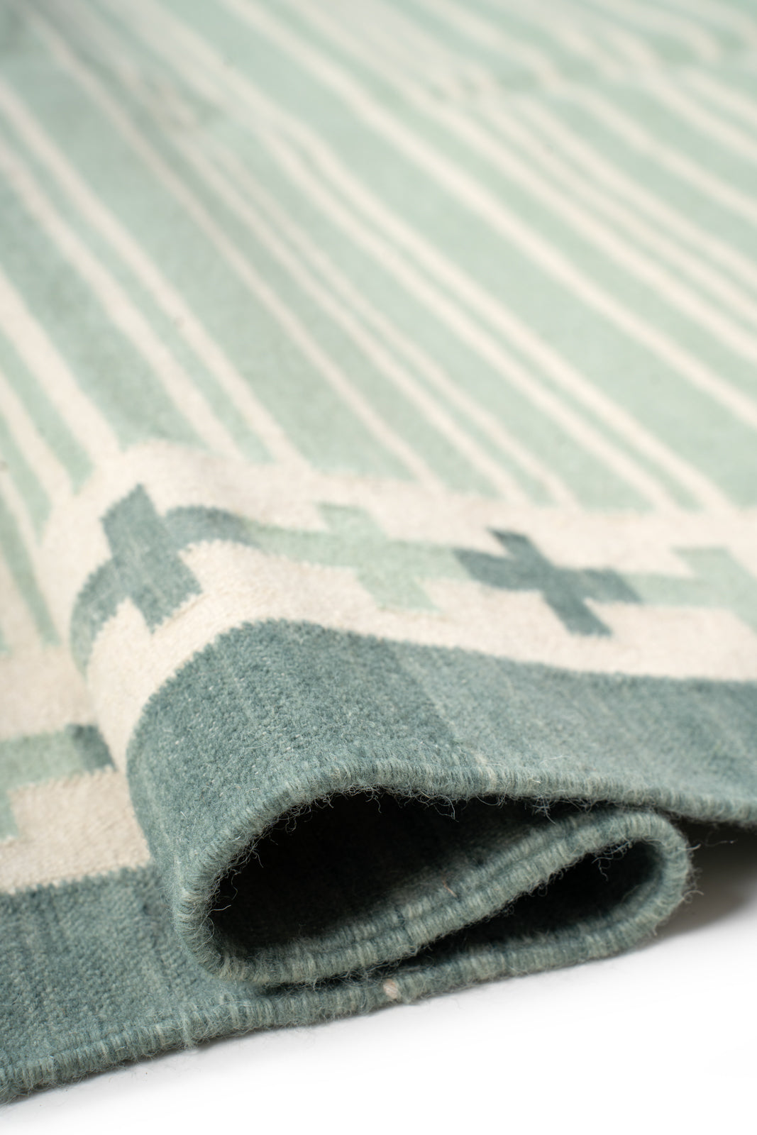 Sage Comfort Flatweave Rug cotton rug styled in a living room interior