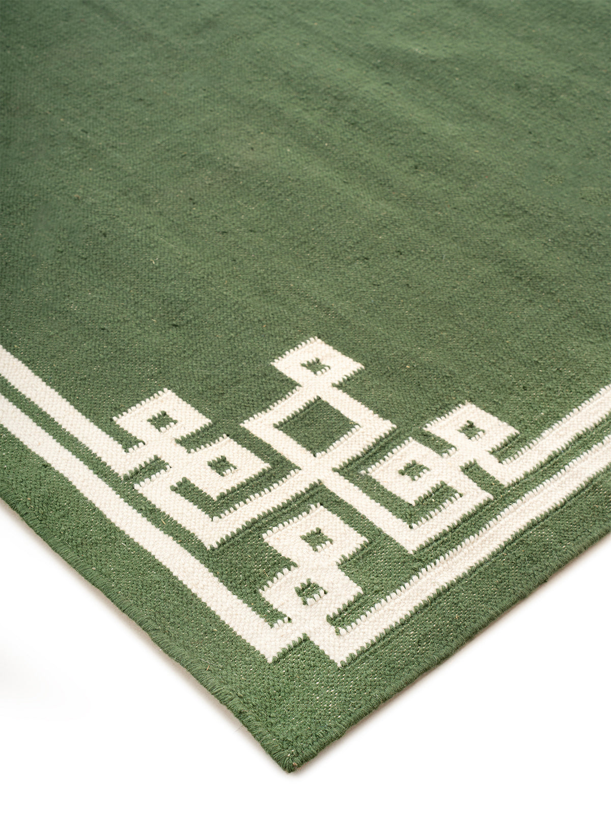 Sage Cornerstone Rug close-up showing the wool weave and geometric motif