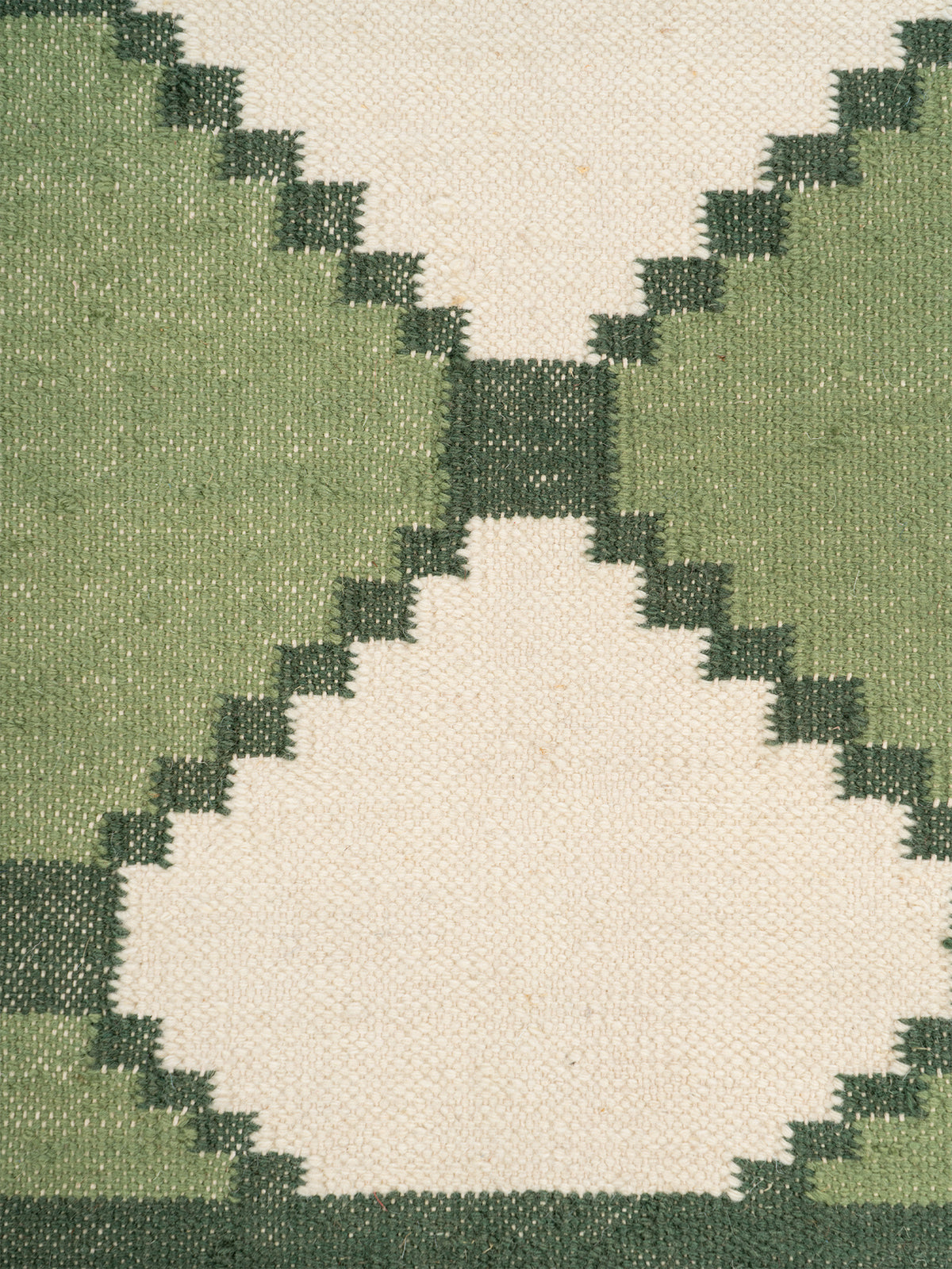 Sage Harlequin Wool Flatweave Rug close-up showing the wool weave and geometric motif