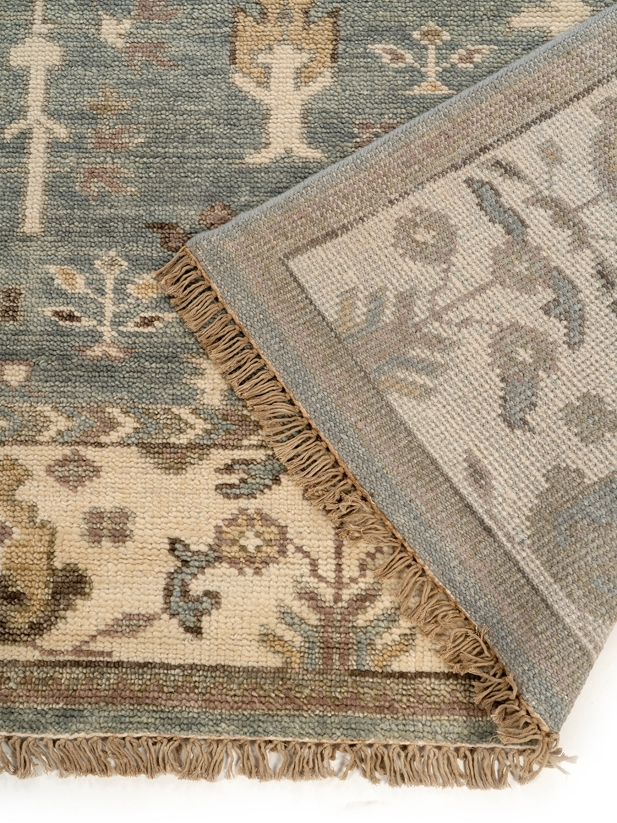 Samarkand Meadow detail of the floral motif in handspun wool cut pile