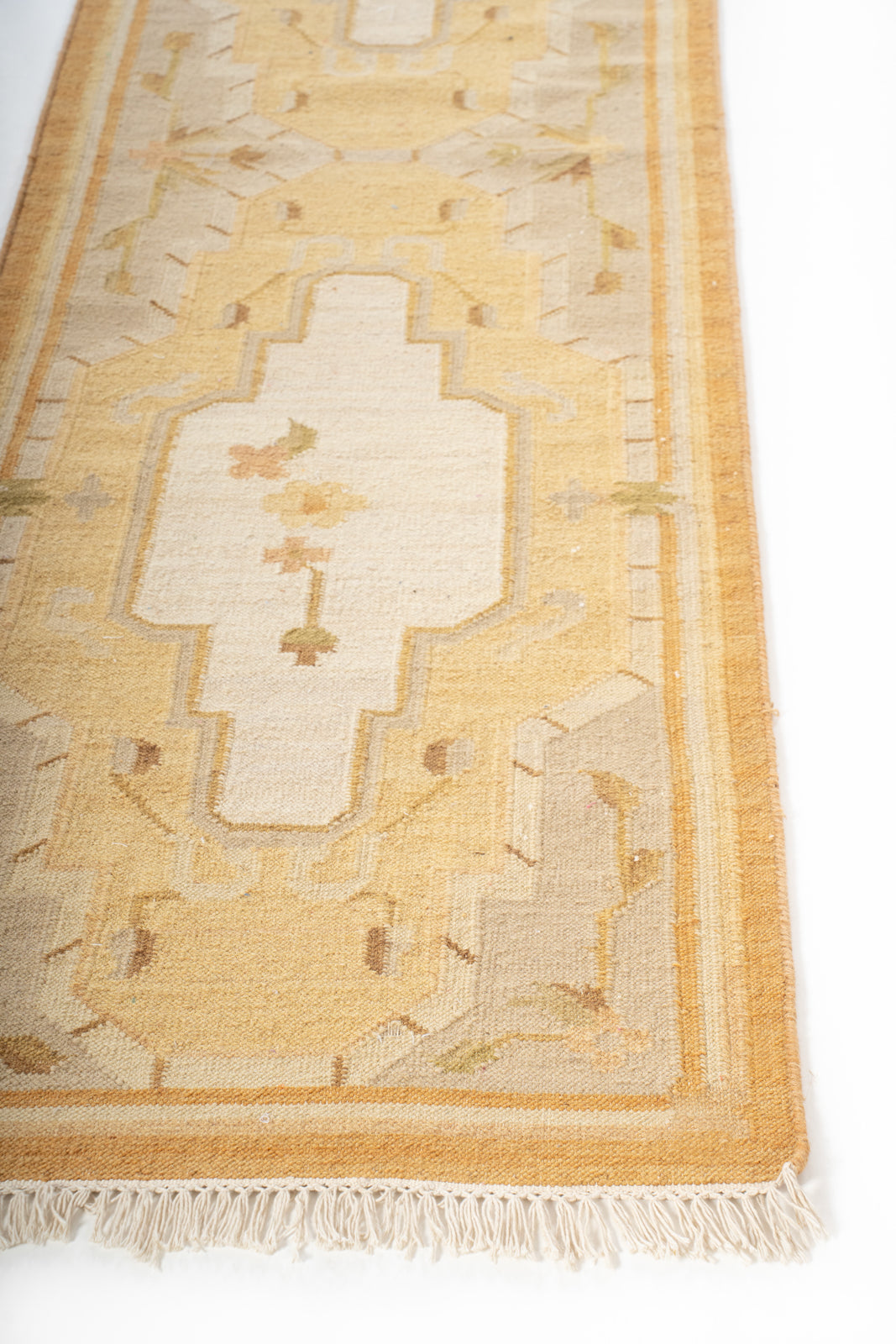 Samarkand Sands Wool Runner wool stair runner styled on a staircase in a designed interior