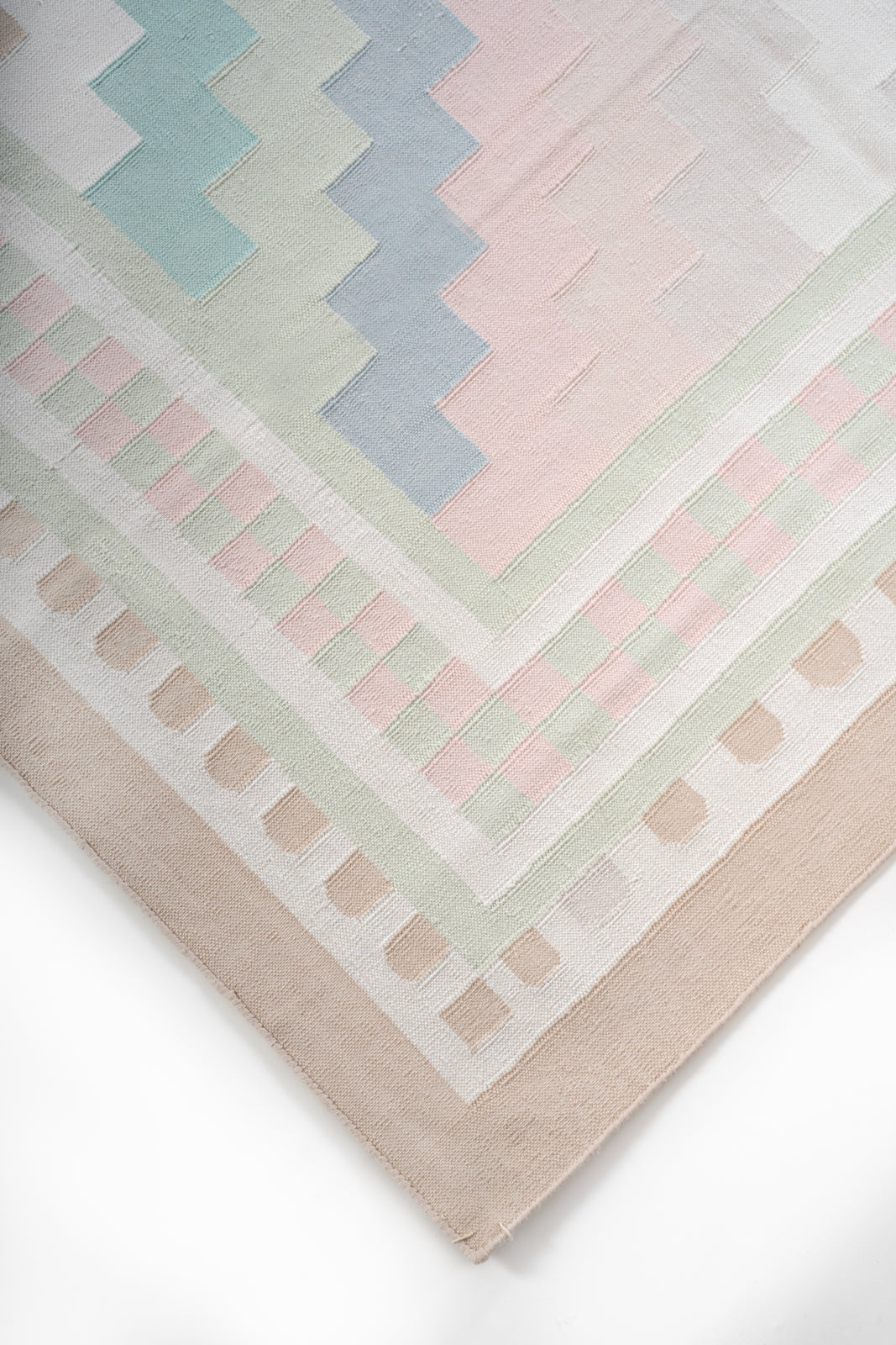 Sanchi Serenity - Antique Handwoven Pastel Rug close-up showing the cotton weave and traditional motif