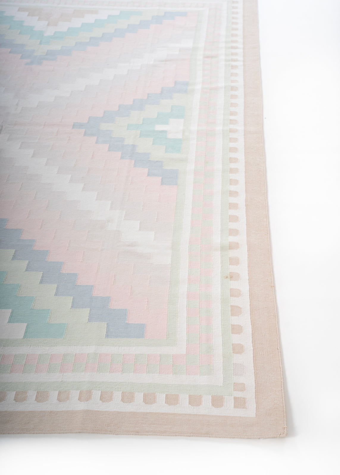 Sanchi Serenity - Antique Handwoven Pastel Rug cotton rug styled in a living room interior