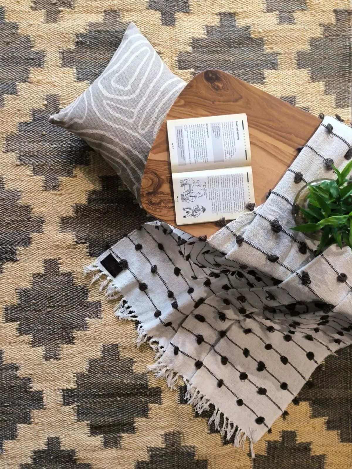 Sand and Shadows Bengal Jute Rug jute rug styled in a living room interior