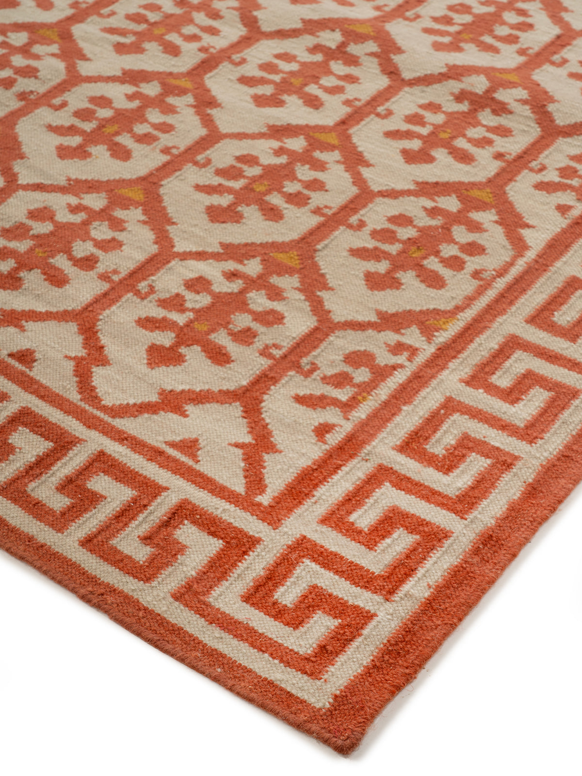 Scarlet Greek Vine Legacy close-up showing the wool weave and traditional motif